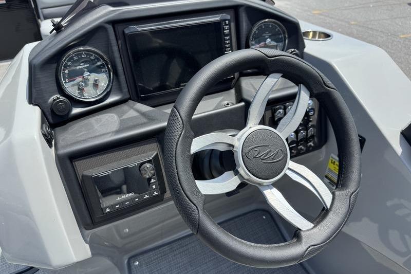 Steering console of 2026 Manitou Encore 25 SL SHP with modern gauges and controls.