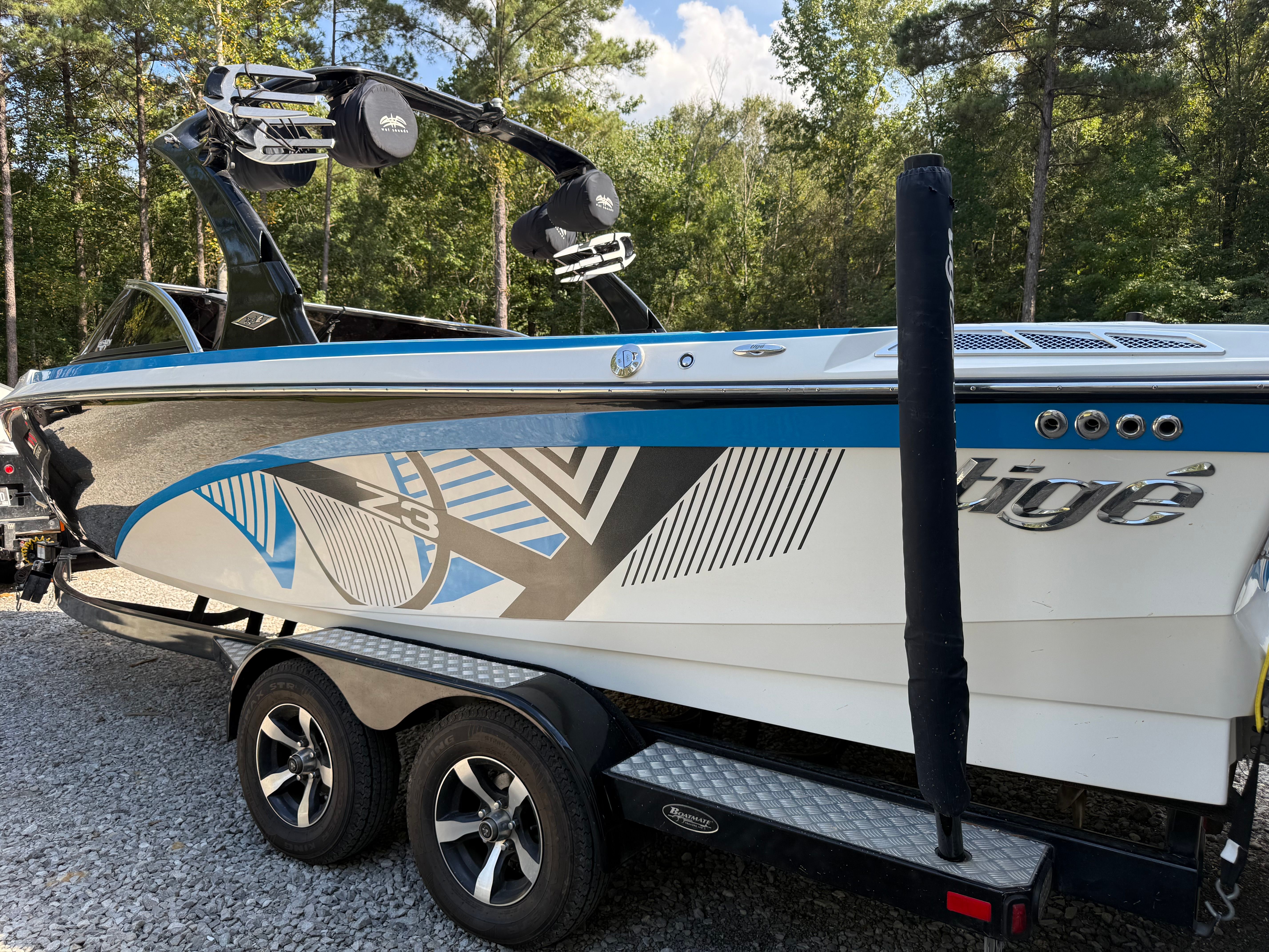 Custom Z3 boat from 2012 parked on trailer outdoors.