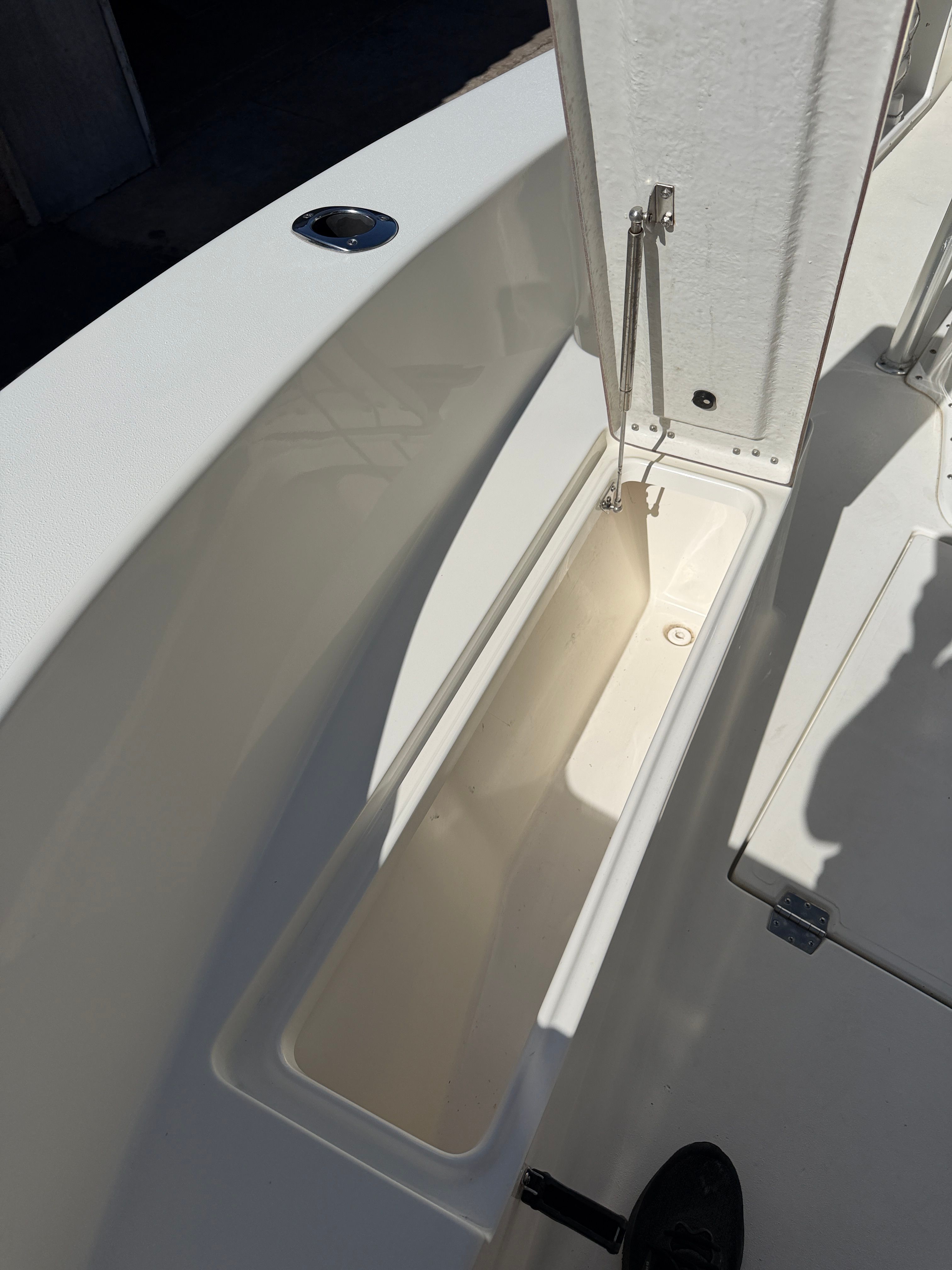 KenCraft Challenger 2021 boat with open storage compartment.