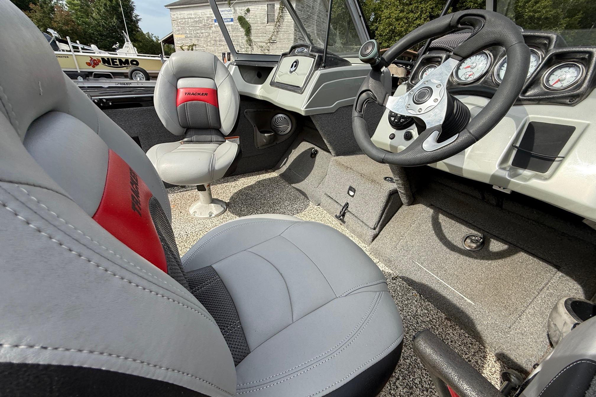 Interior of a 2016 Tracker Targa V-18 WT boat, featuring steering wheel and seats.