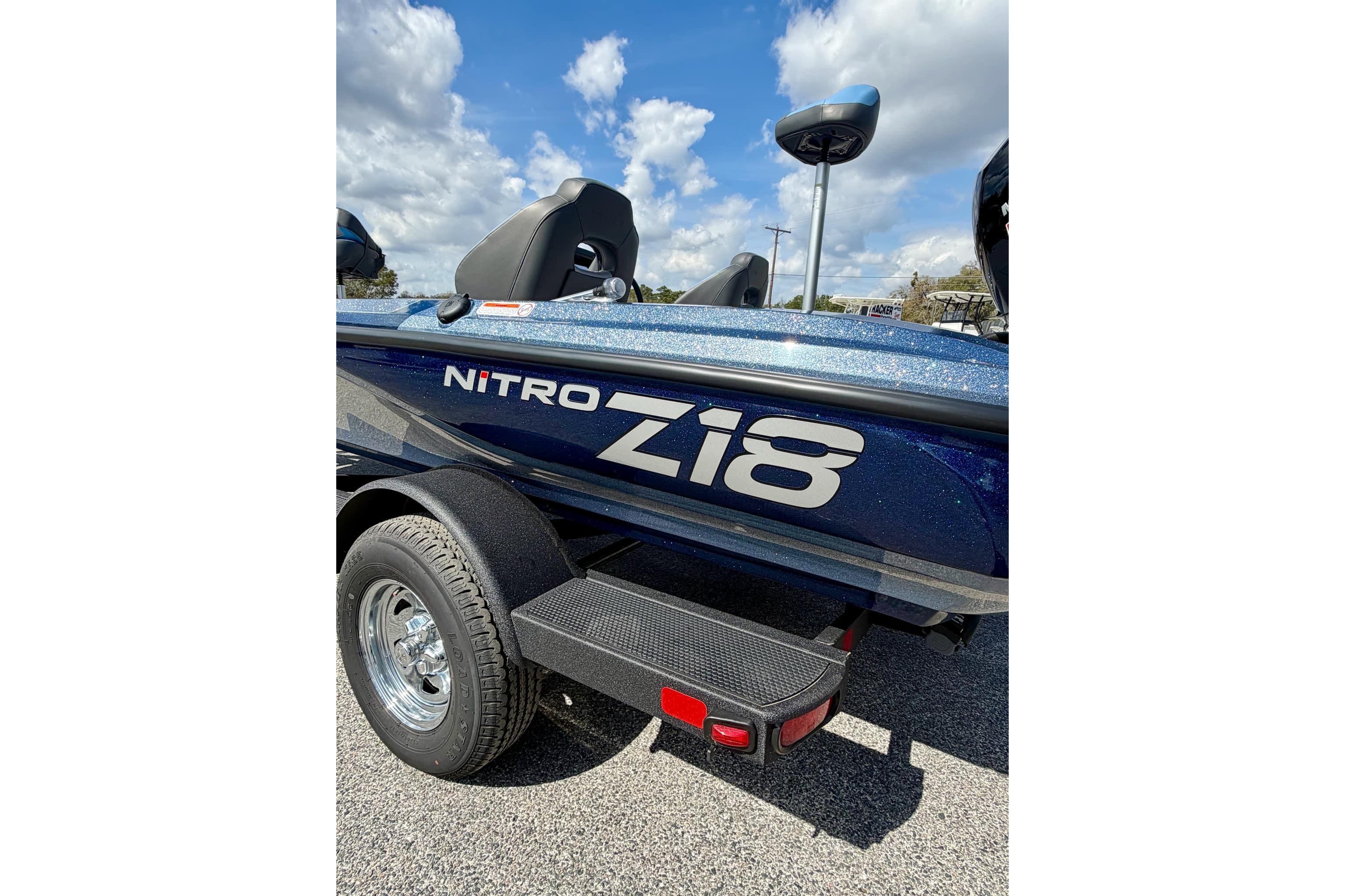 2026 Nitro Z18 boat with sleek design and metallic finish under a blue sky.