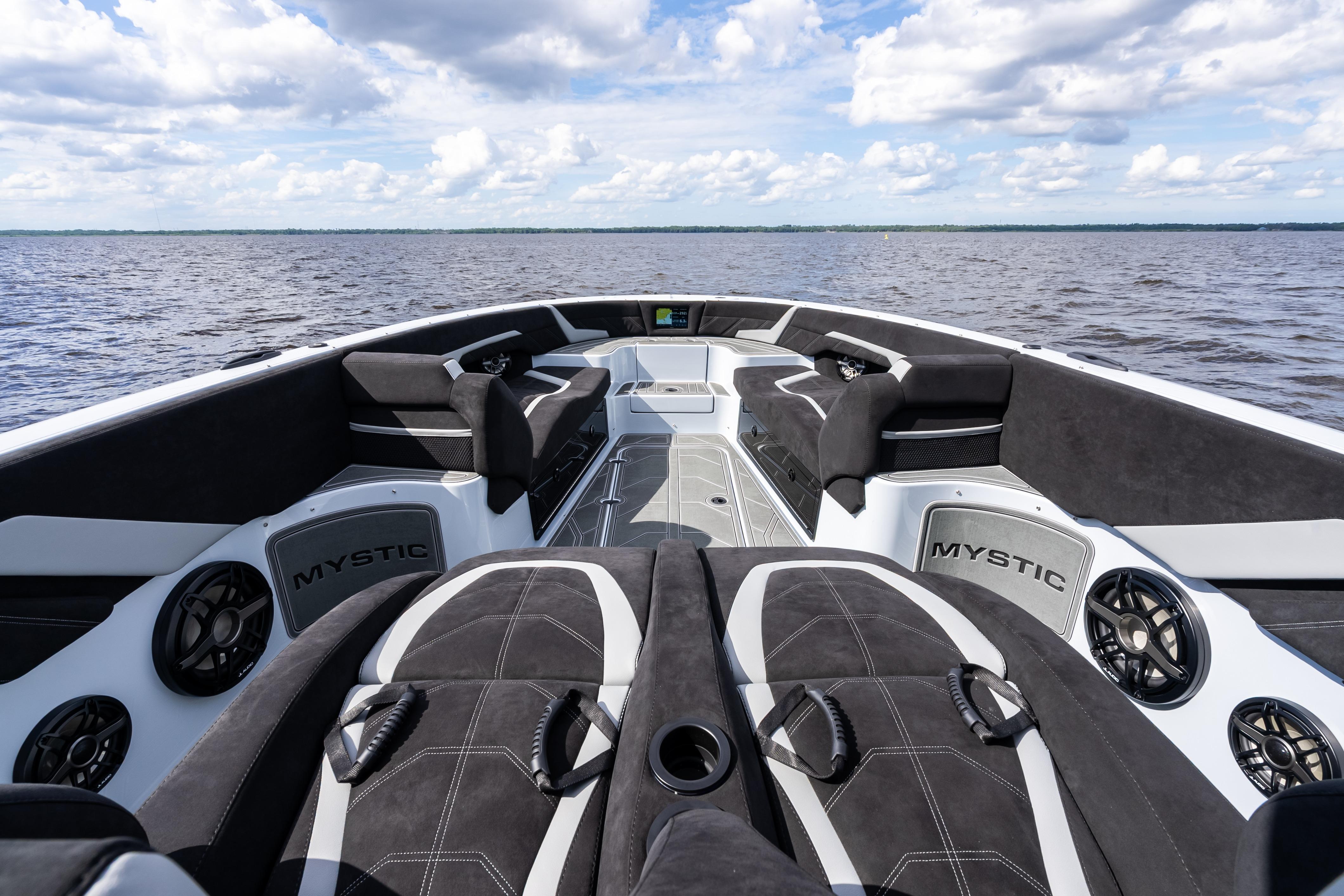2027 Mystic Powerboats M4200 interior with luxurious seating on open water.