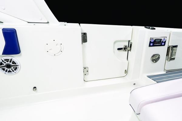 Manufacturer Provided Image: 2019 Chaparral 300 OSX boat interior, featuring a white door and control panel.