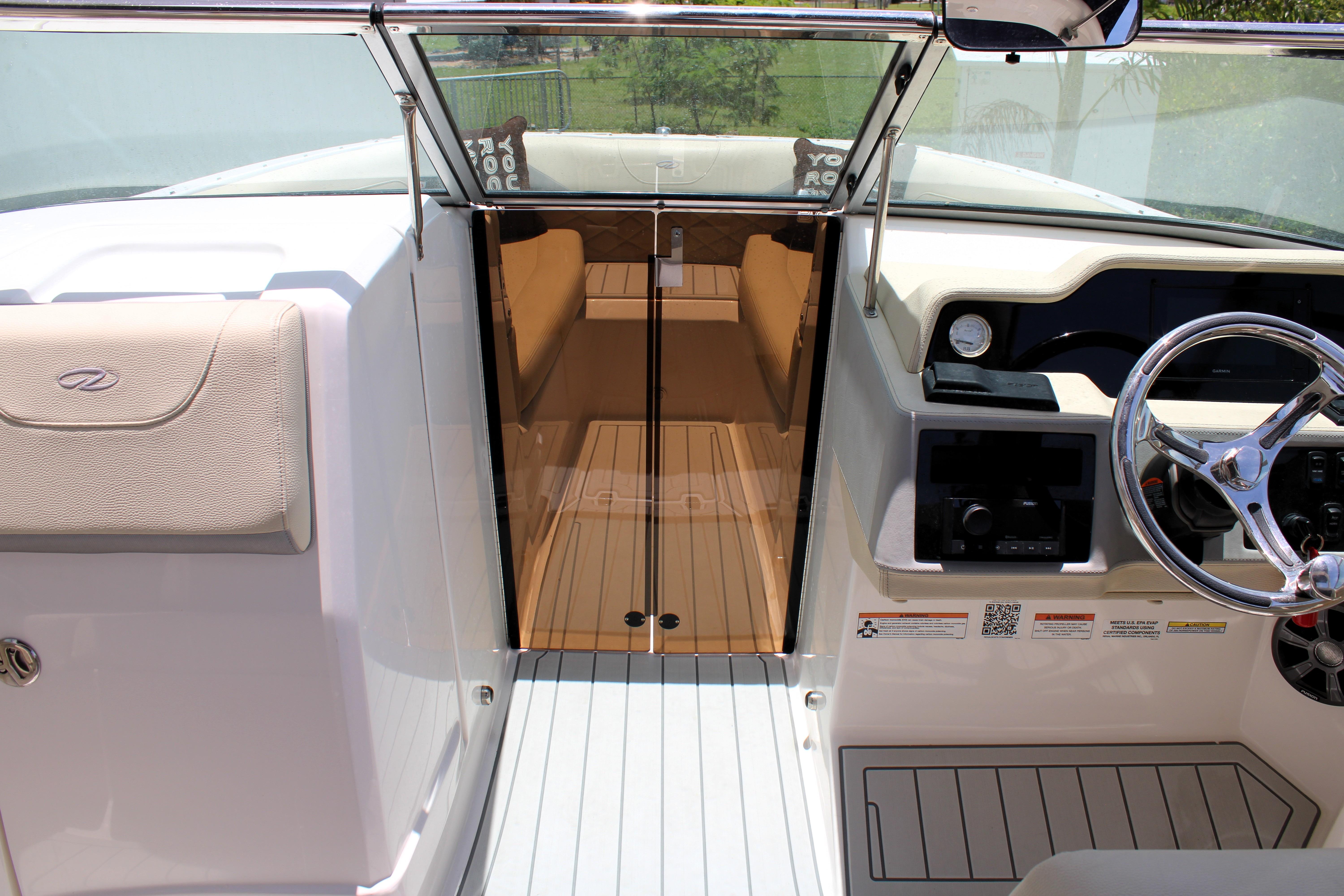 2021 Regal 26 OBX boat interior with steering wheel and cabin entrance.