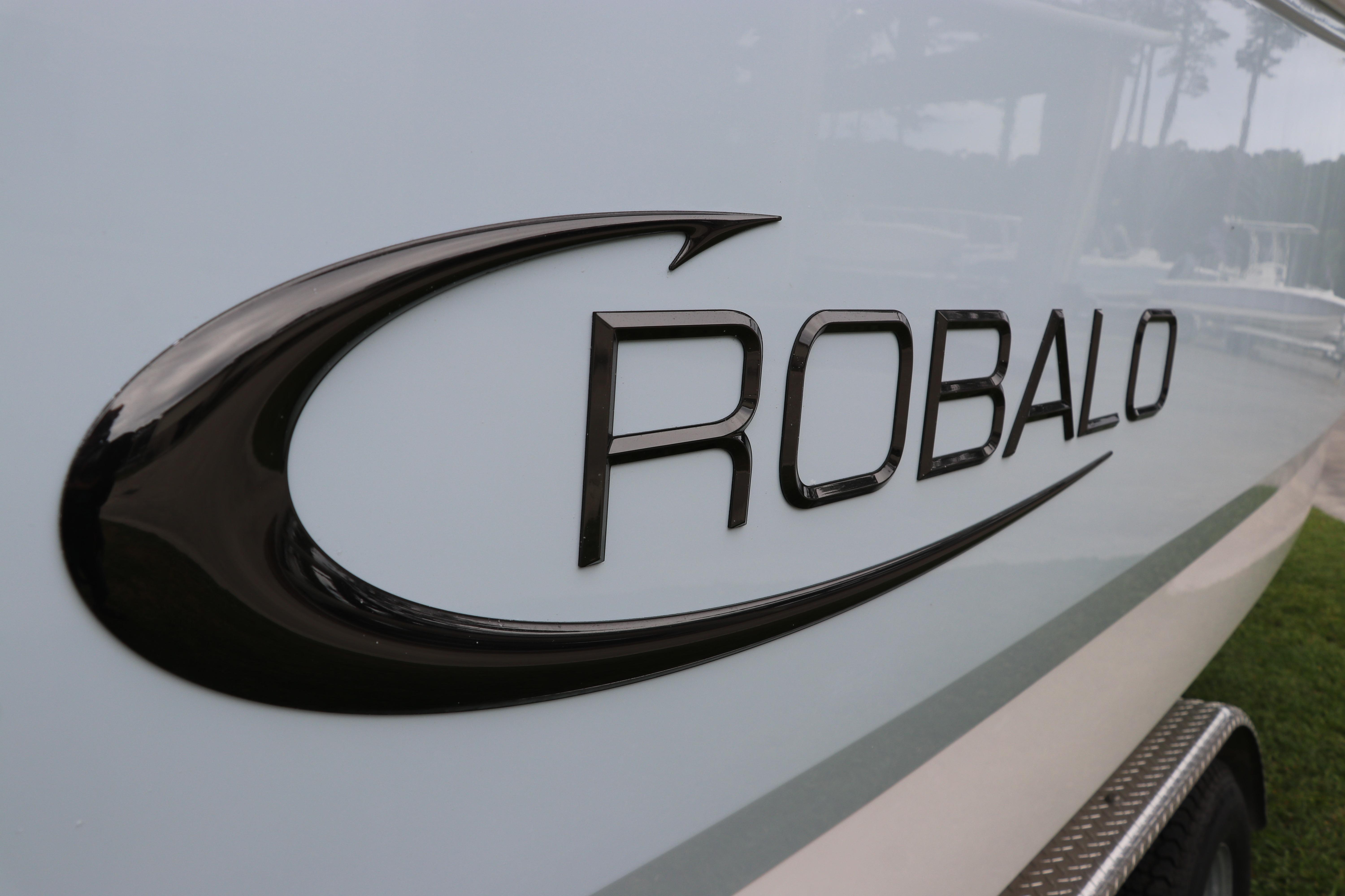 2026 Robalo R257 Dual Console boat logo on sleek white hull.