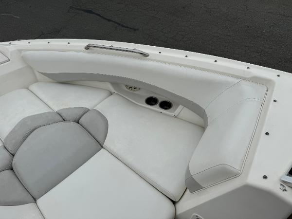 2006 Larson LXi 248 boat interior with white and gray seating.