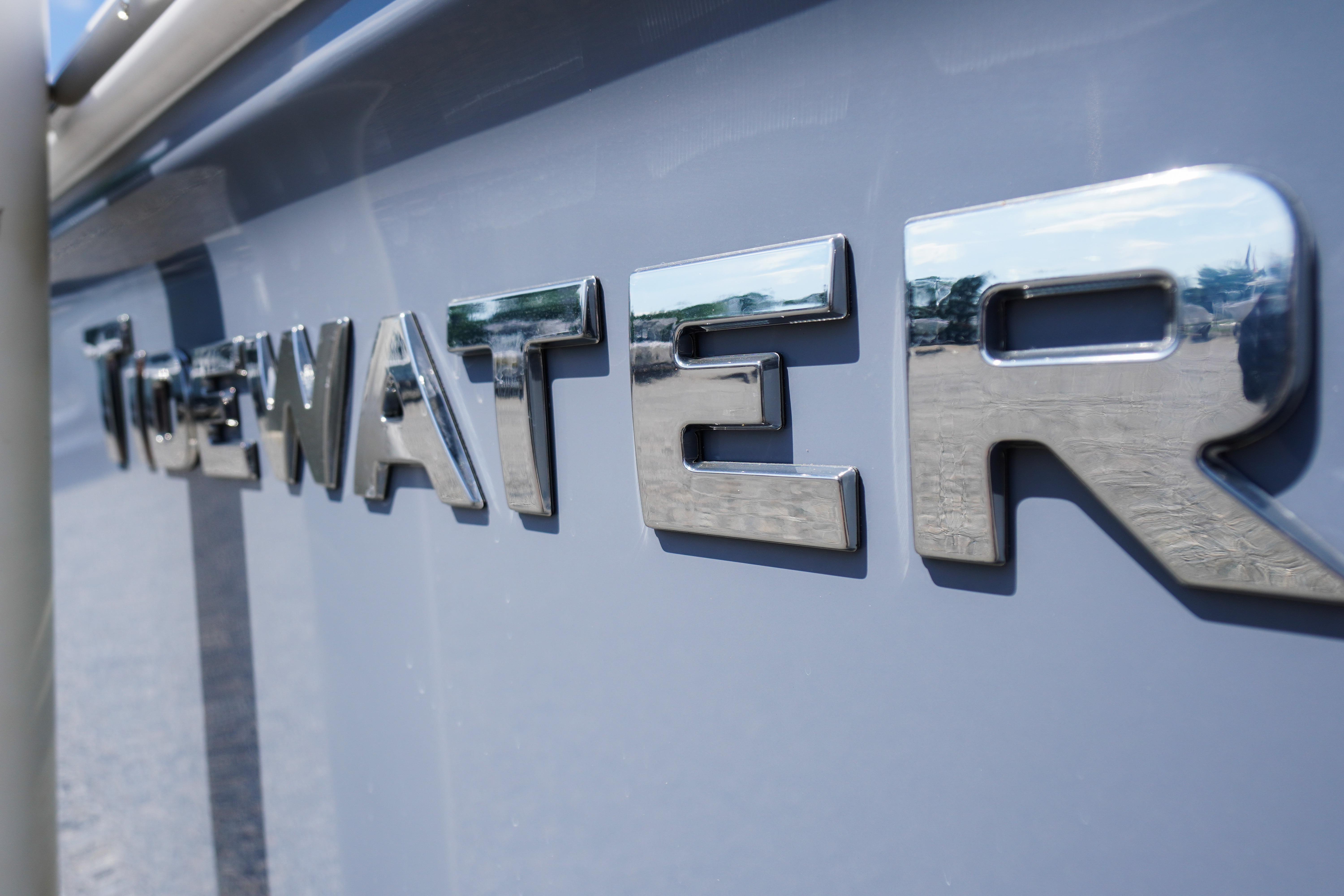Close-up of 2026 Tidewater 220 CC Adventure boat logo in chrome.