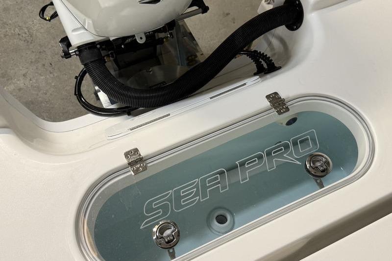2026 Sea Pro 250 Bay boat livewell with logo, showcasing sleek design and functionality.