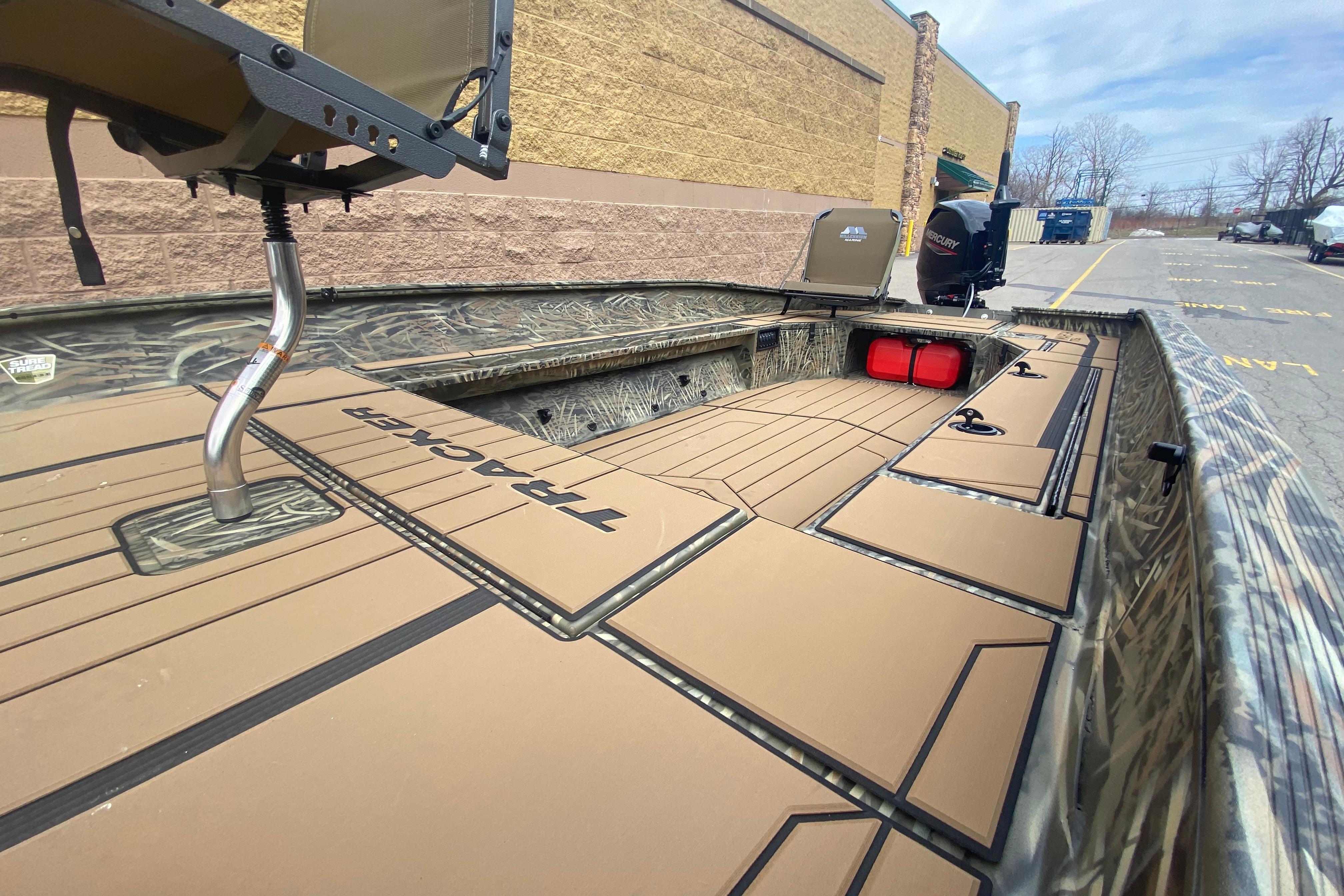 2026 Tracker Grizzly 1756 T Marsh boat with camo design and spacious deck.