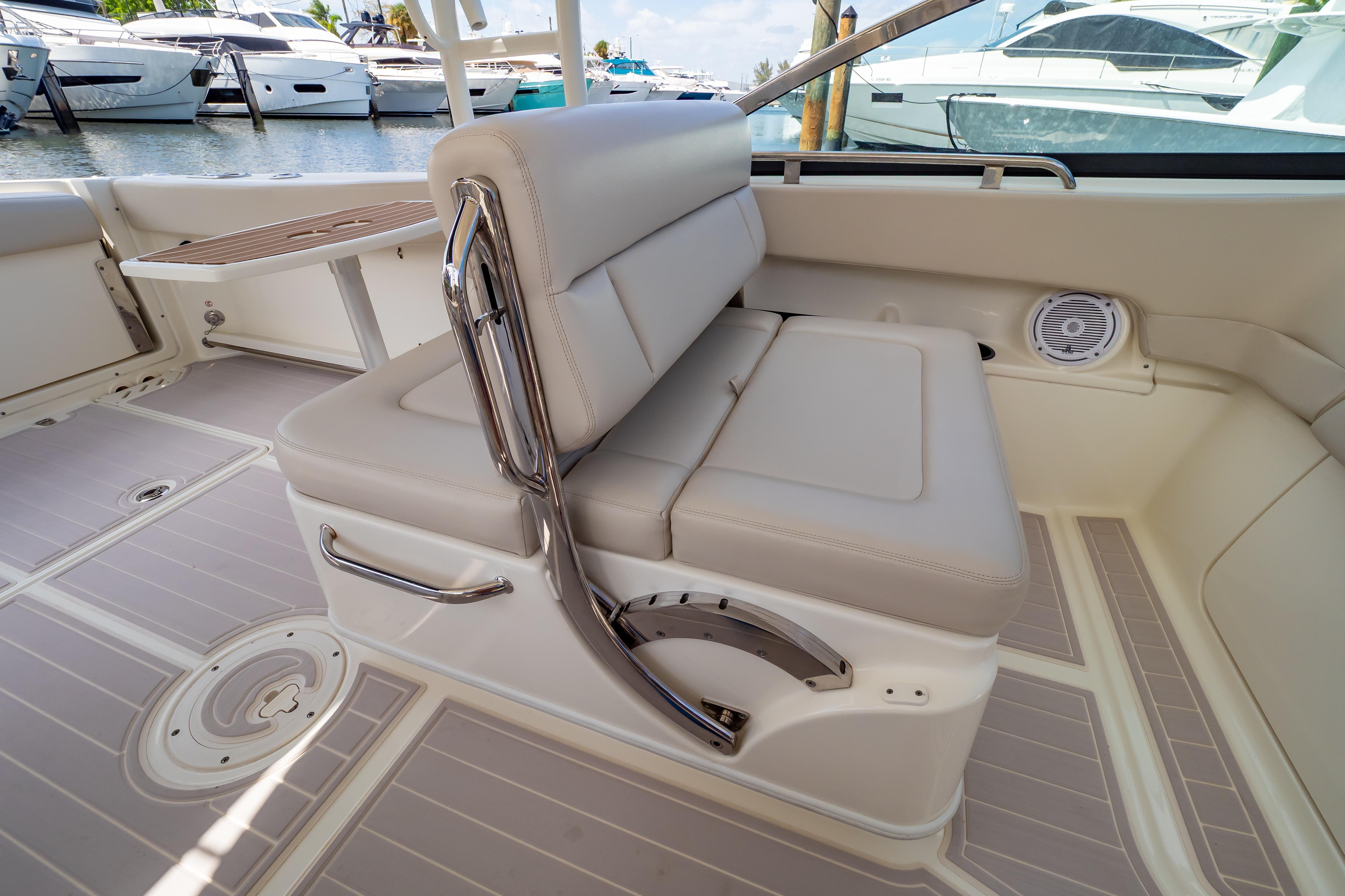 2019 Boston Whaler 270 Vantage interior with cushioned seating and sleek design.