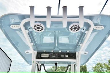 2026 Sea Hunt Ultra 255 SE boat roof with rod holders and speakers.