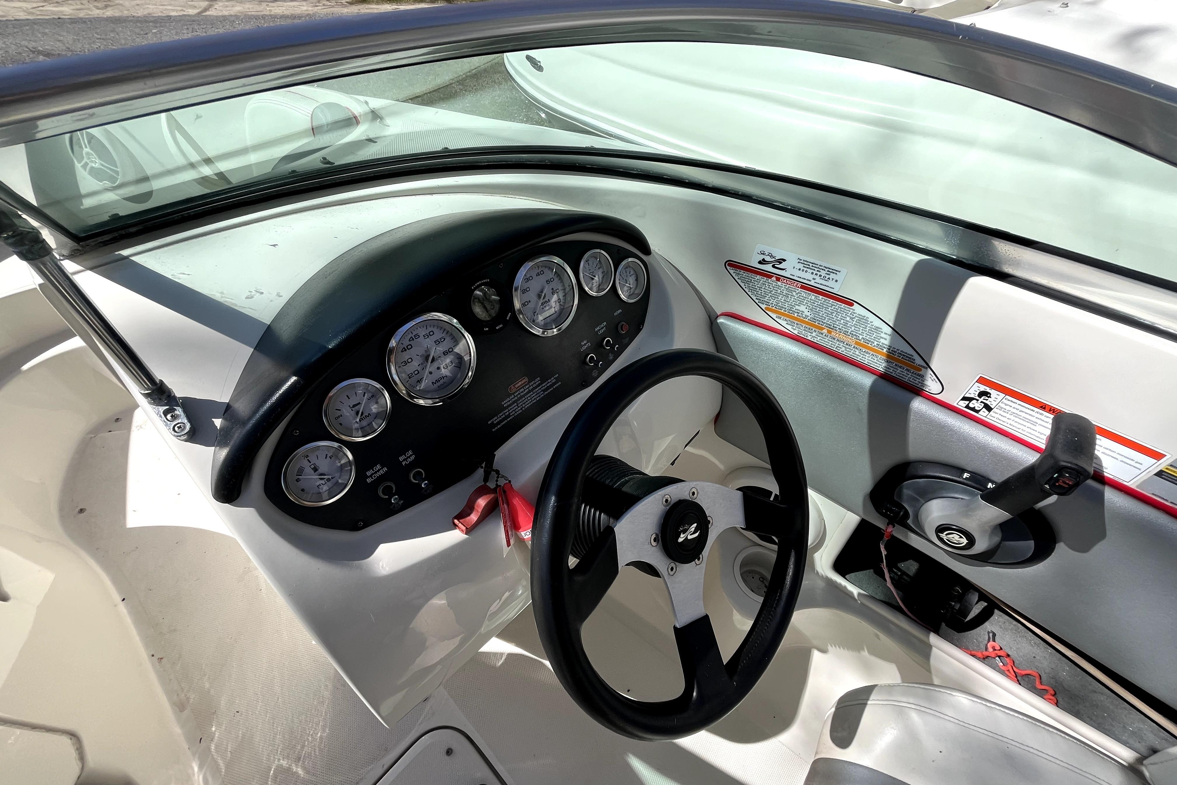 2008 Sea Ray 185 Sport boat dashboard with steering wheel and instrument panel.