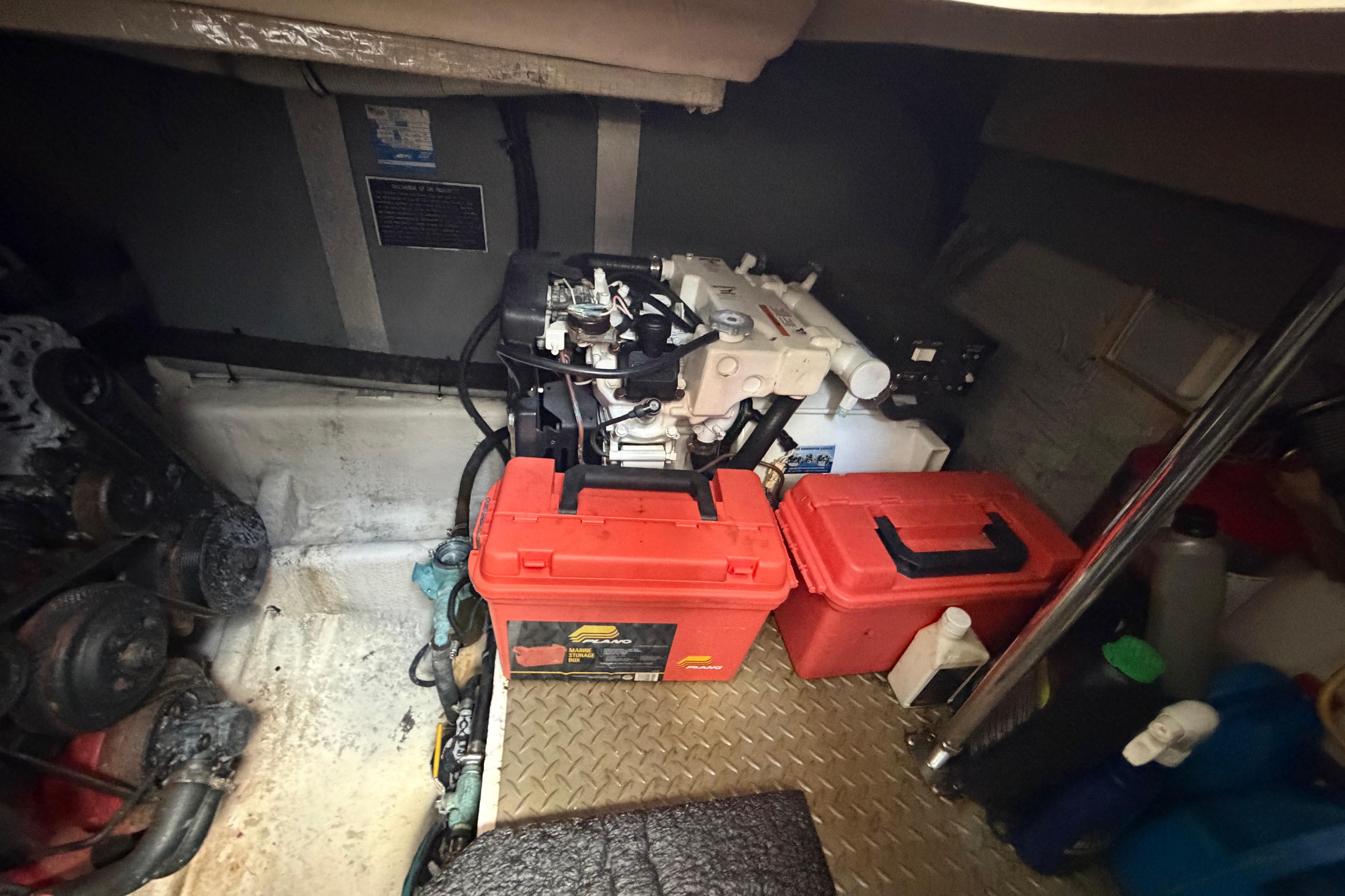 Engine room of a 2007 Monterey 350 Sport Yacht with tools and equipment.