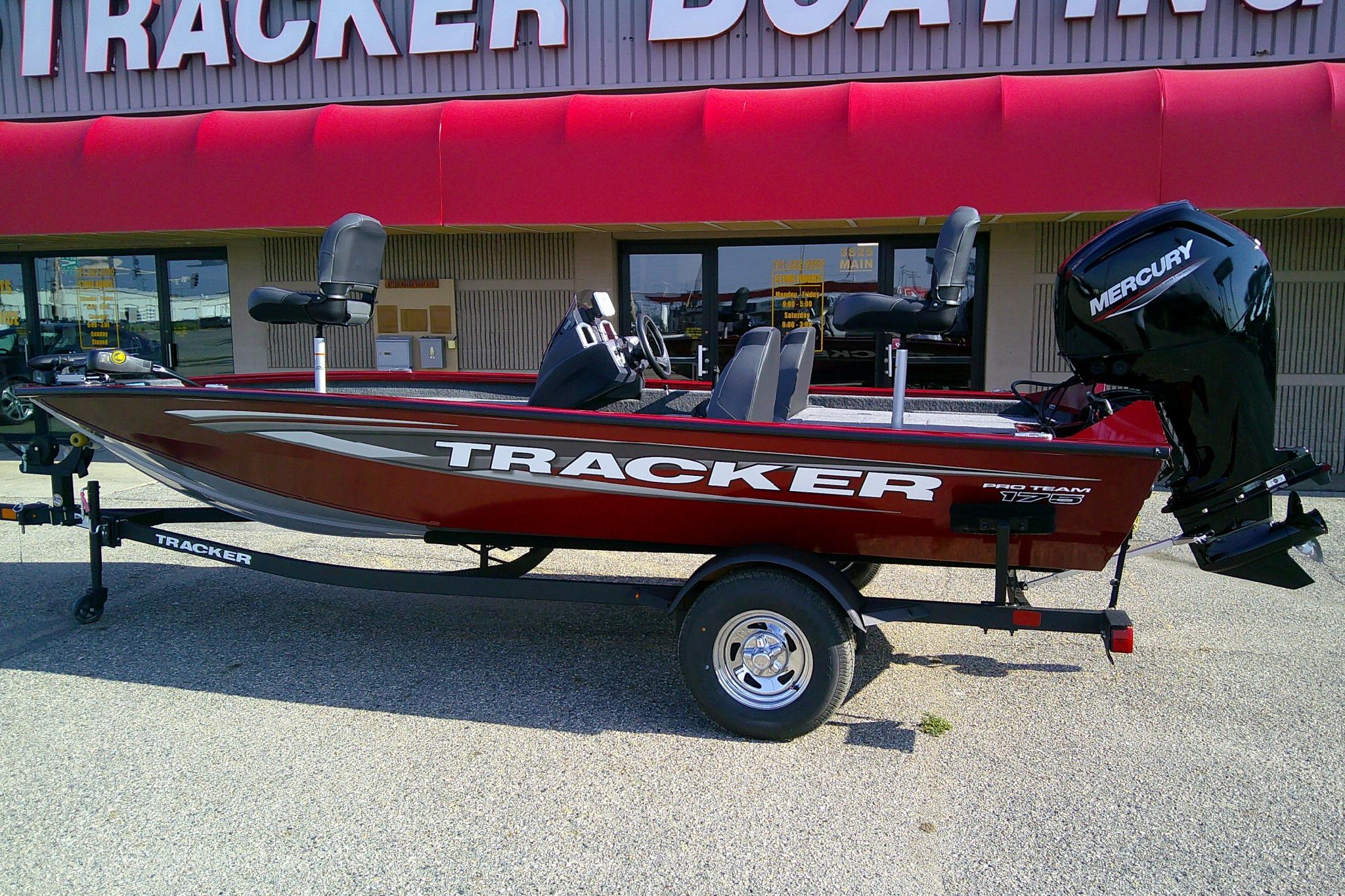 2025 Tracker Pro Team 175 boat with Mercury engine, displayed outside dealership.