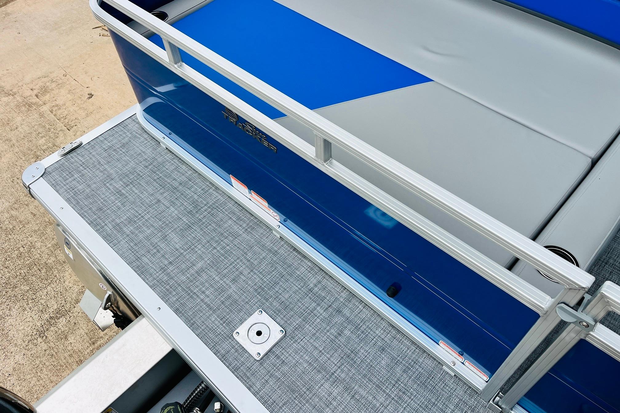 2026 Sun Tracker Party Barge 22 RF DLX, blue and gray deck, sleek design.