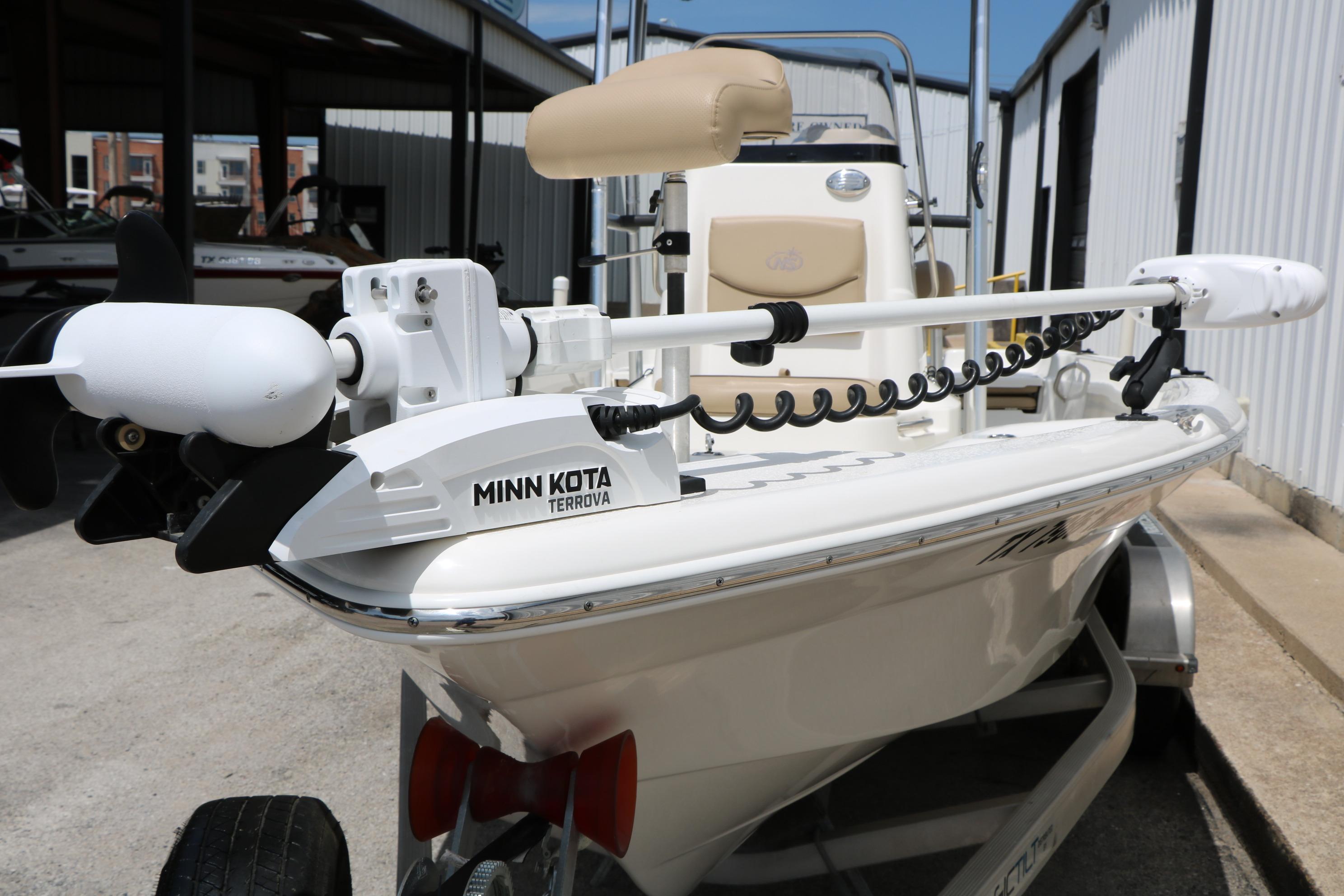 2020 NauticStar 2140 Sport boat with Minn Kota Terrova trolling motor, parked on a trailer.