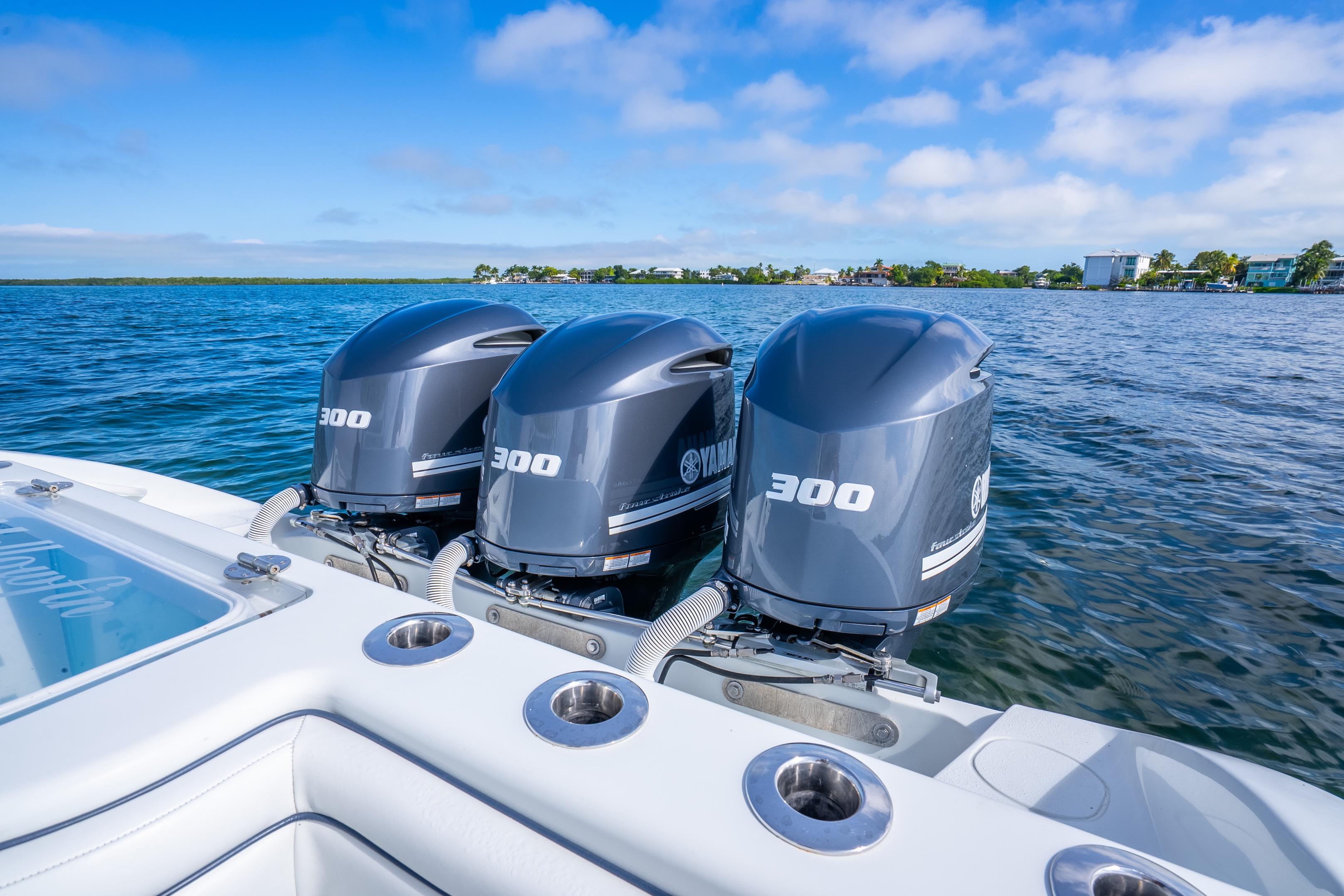 2016 Yellowfin 36 Offshore boat with triple Yamaha 300 engines on open water.