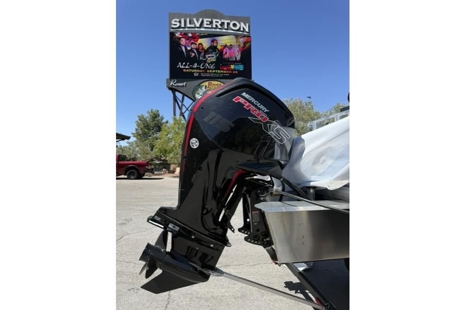 2026 Sun Tracker Fishin' Barge 20 DLX with Mercury Pro XS engine in parking lot.