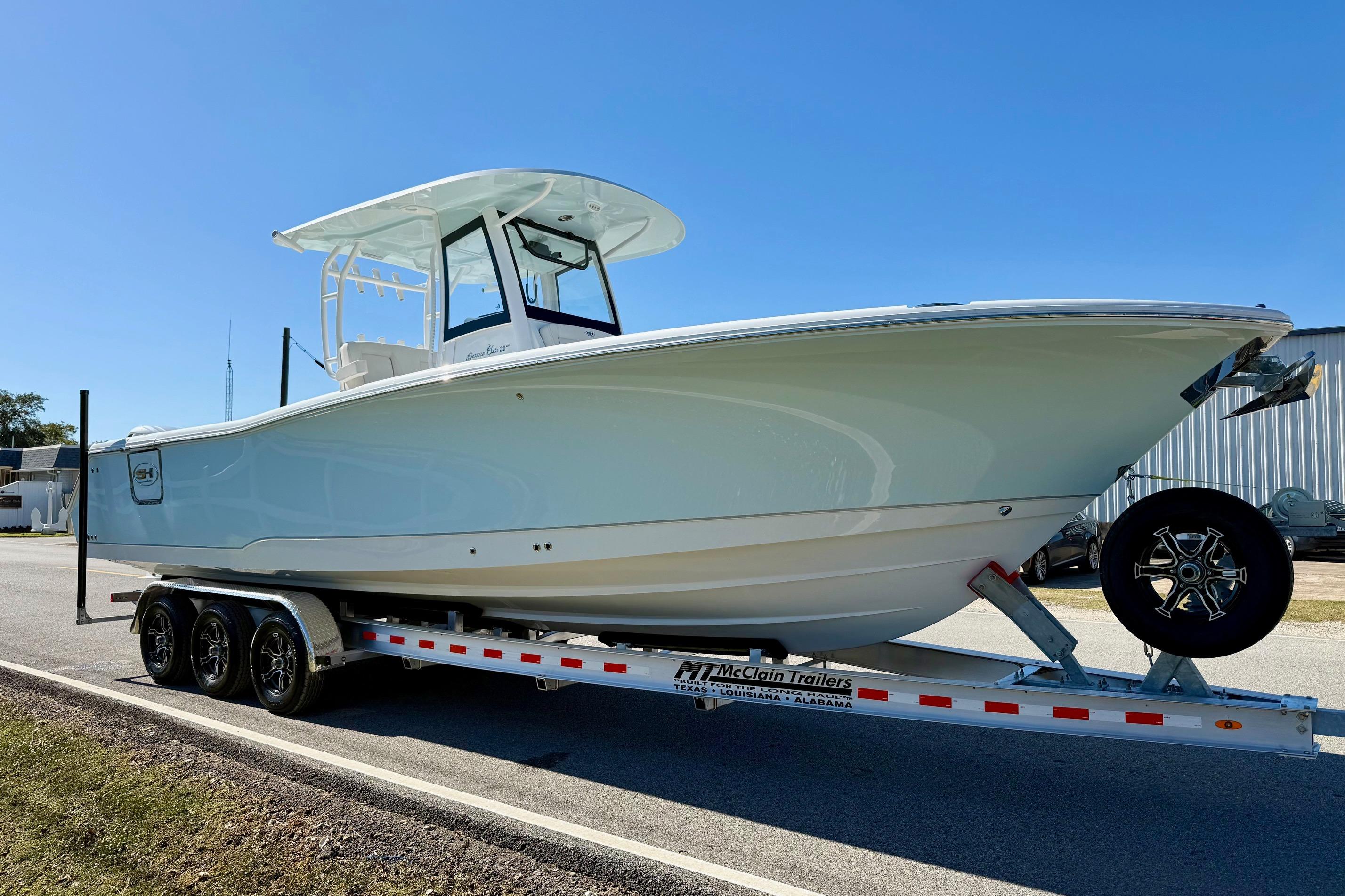 2026 Sea Hunt Gamefish 30 Coffin Box boat on trailer, side view.
