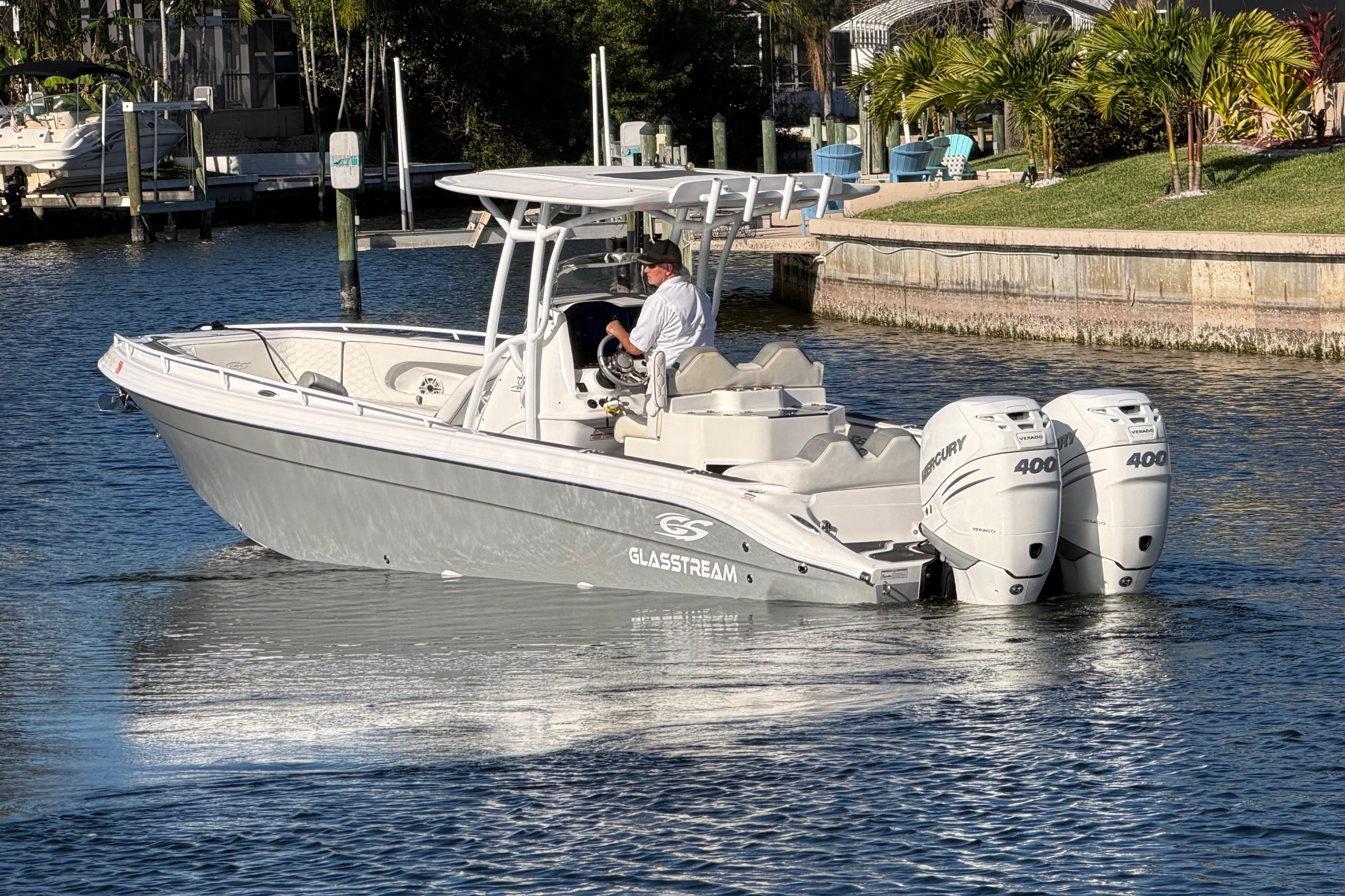 2022 Glasstream 328 Pro-XS boat cruising on a sunny waterway.