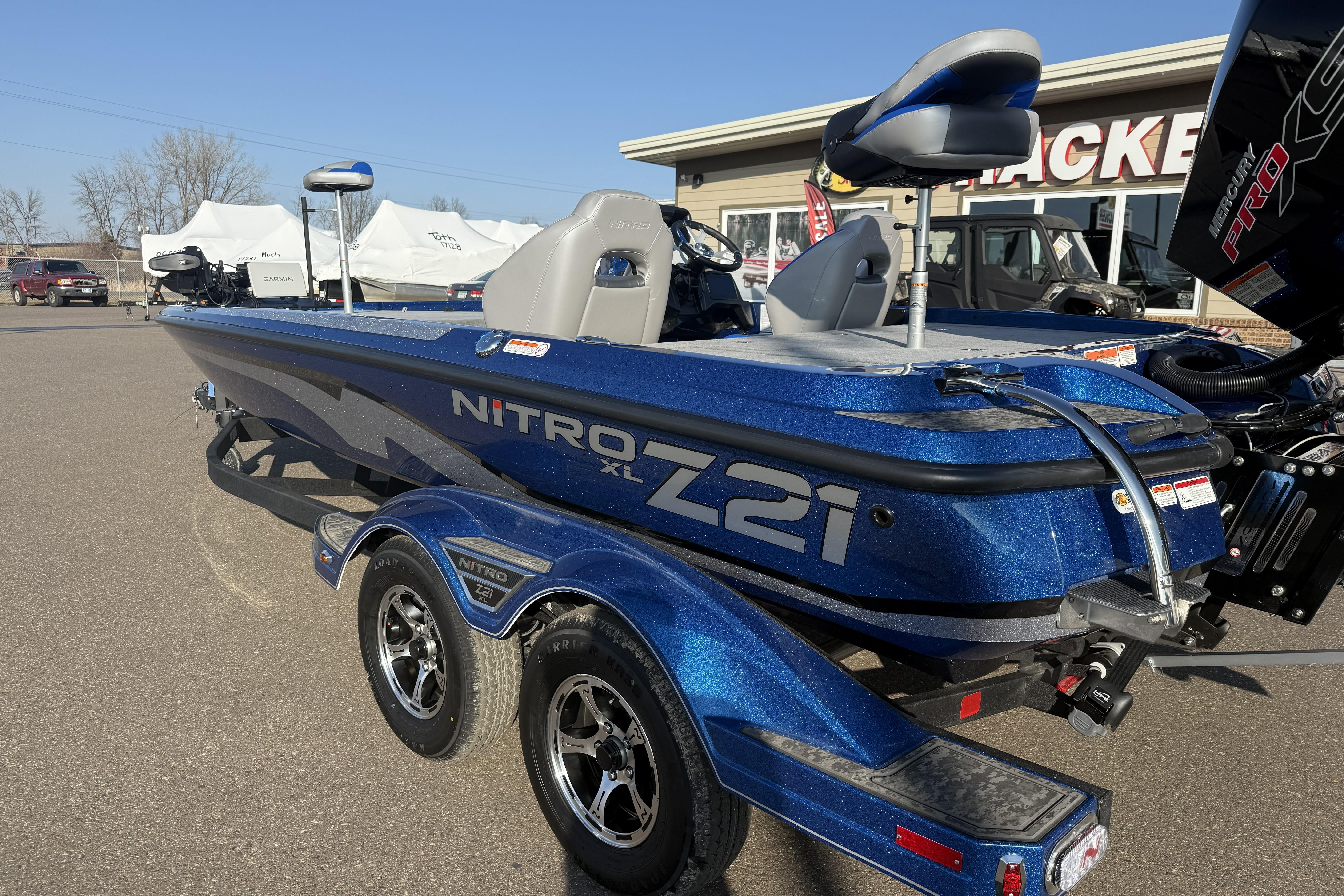 2026 Nitro Z21 XL Pro boat in blue, parked outdoors on a sunny day.