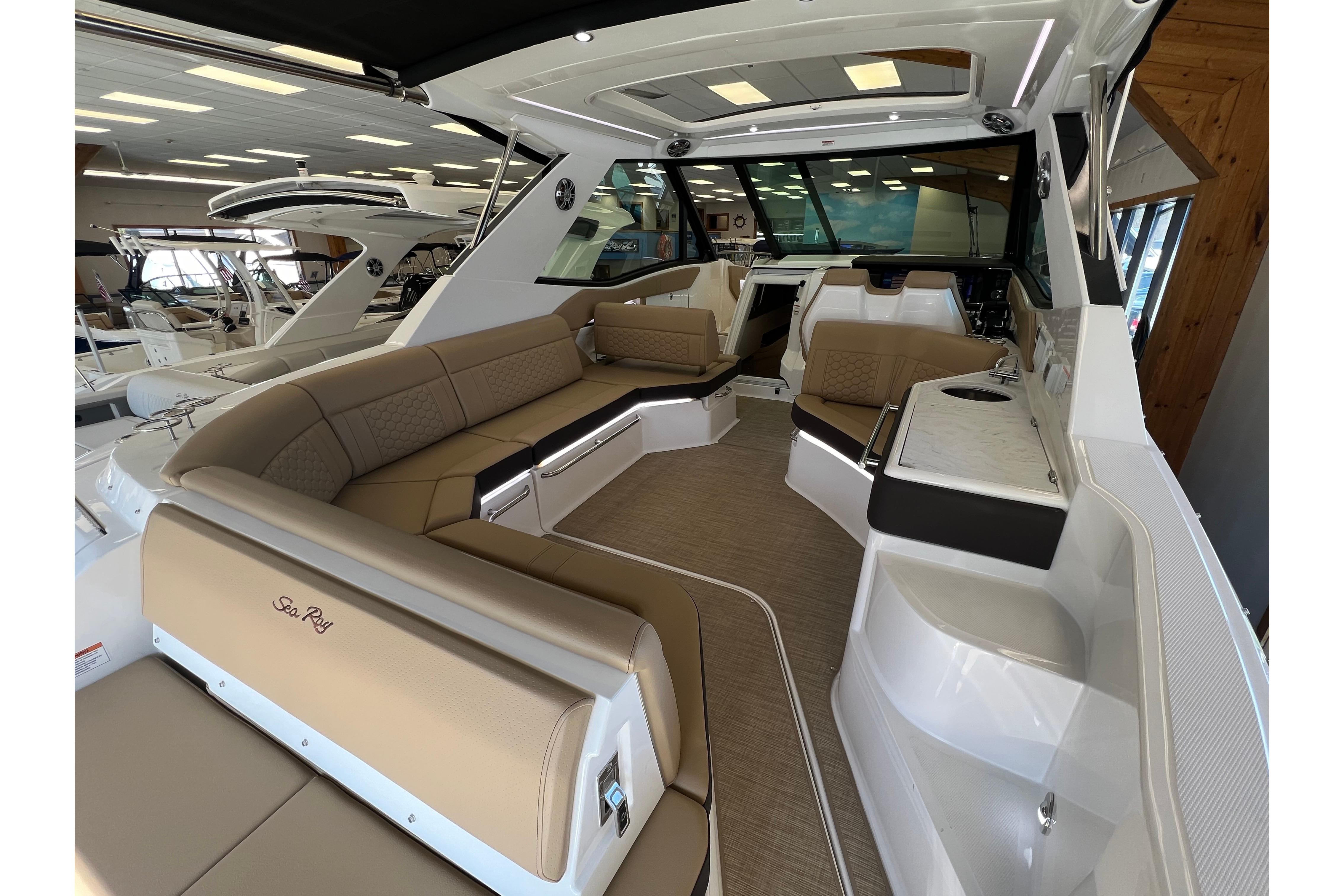 2024 Sea Ray Sundancer 320 interior with luxurious seating and modern design.