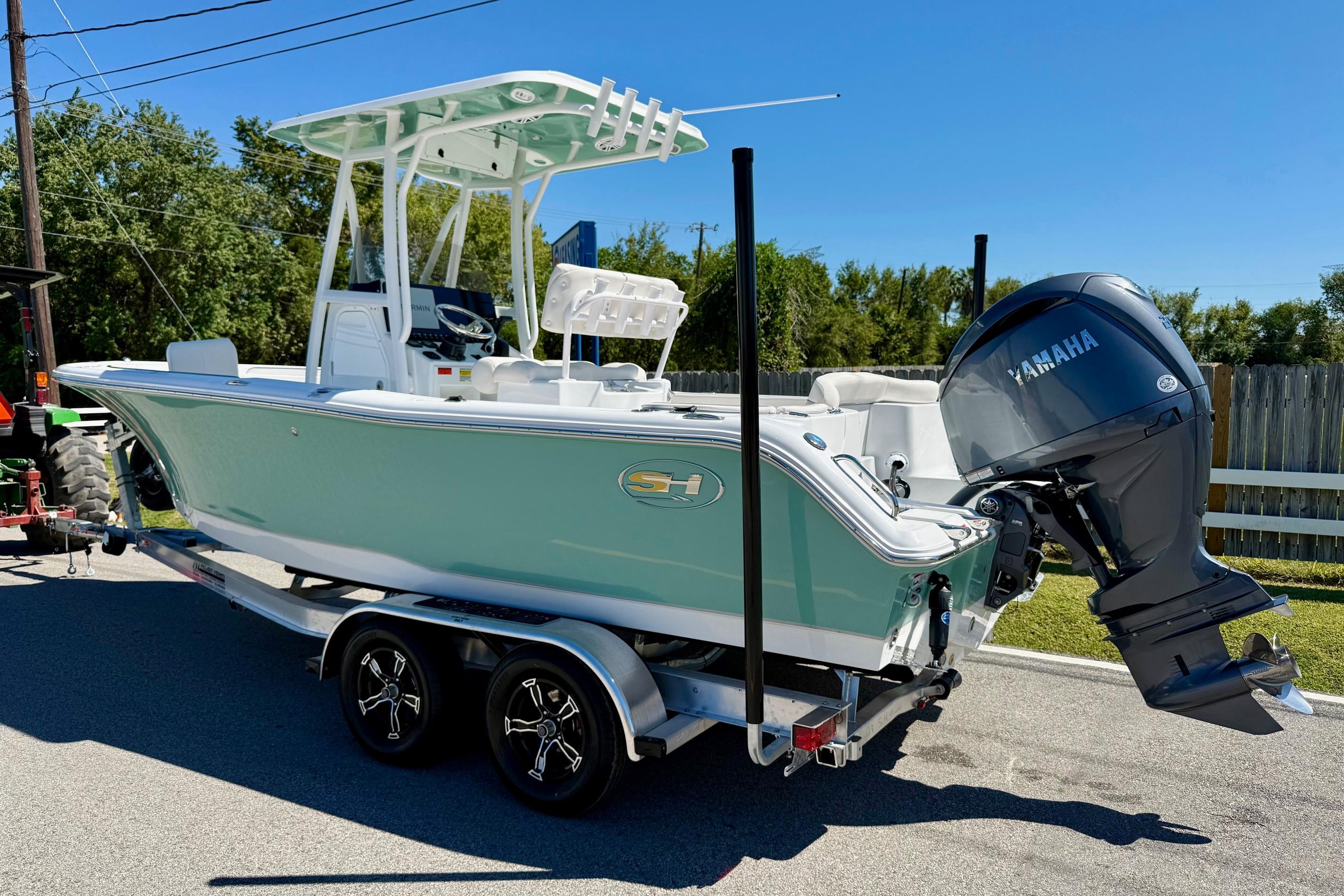 2026 Sea Hunt Ultra 229 boat on trailer with Yamaha outboard motor.