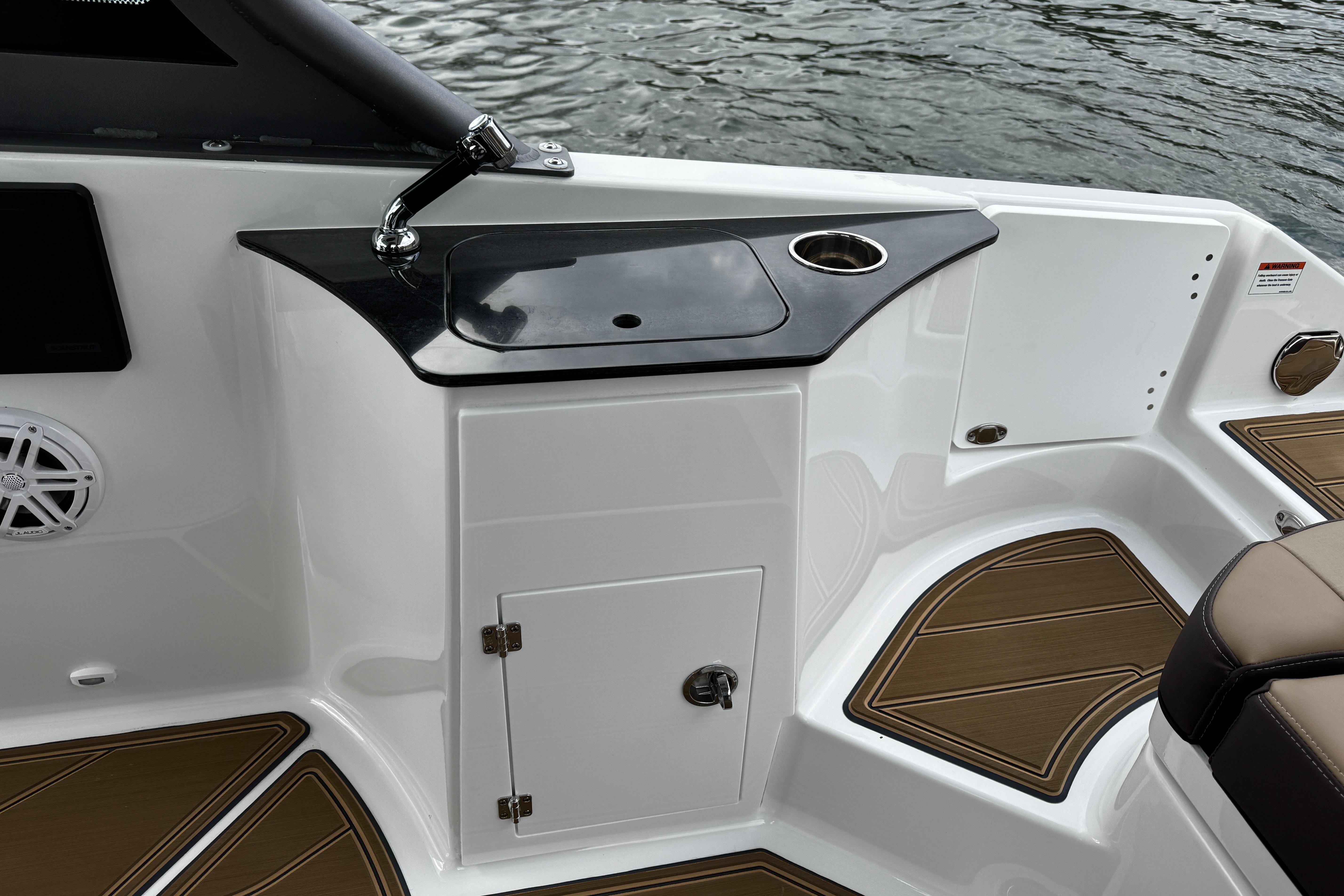 2026 Monterey Elite 25 OB boat interior with sink and seating area.
