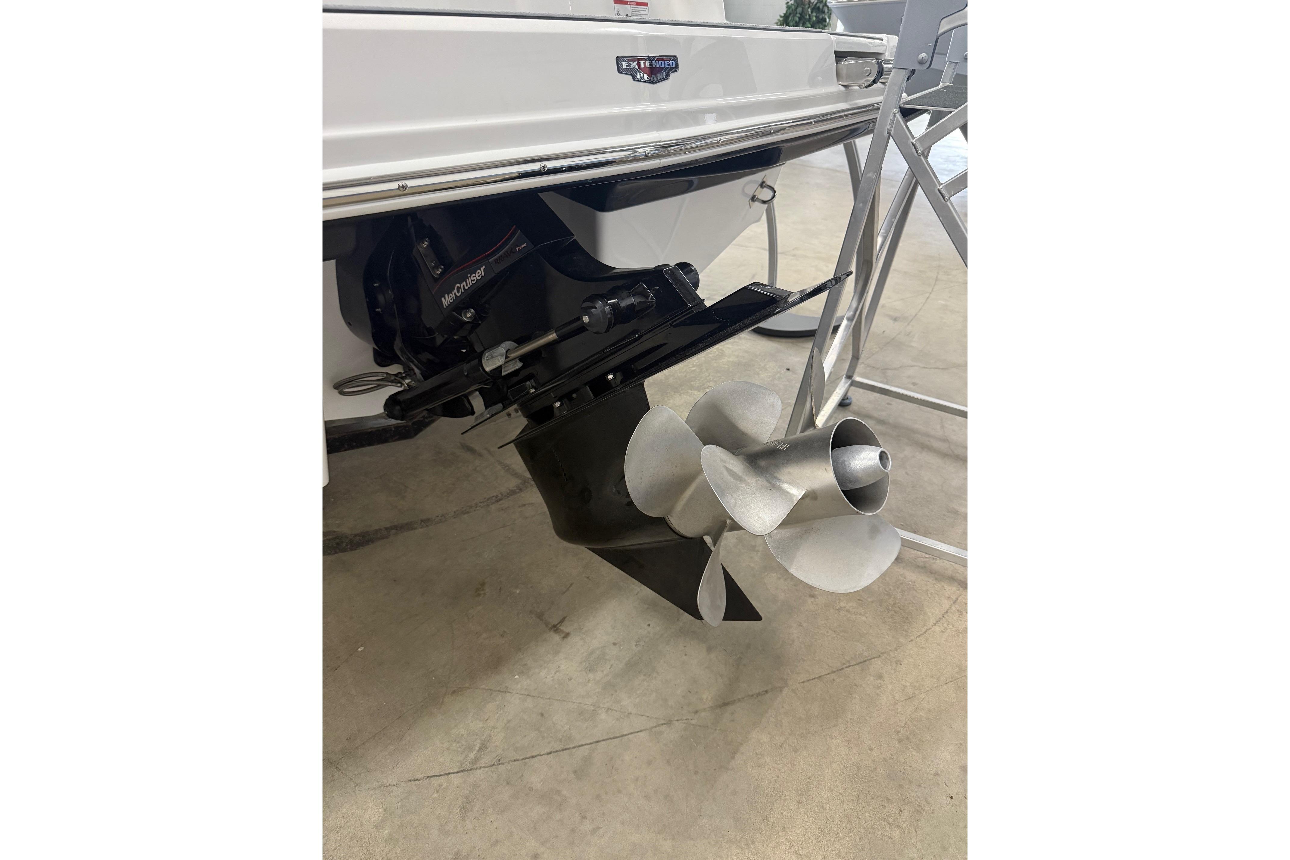2026 Chaparral 23 SSi boat with MerCruiser outdrive and stainless steel propeller.
