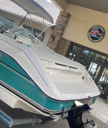 1992 Regal Valanti 200 boat parked in front of a building.