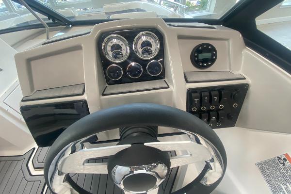 2024 Starcraft SVX 190 boat dashboard with steering wheel and control panel.