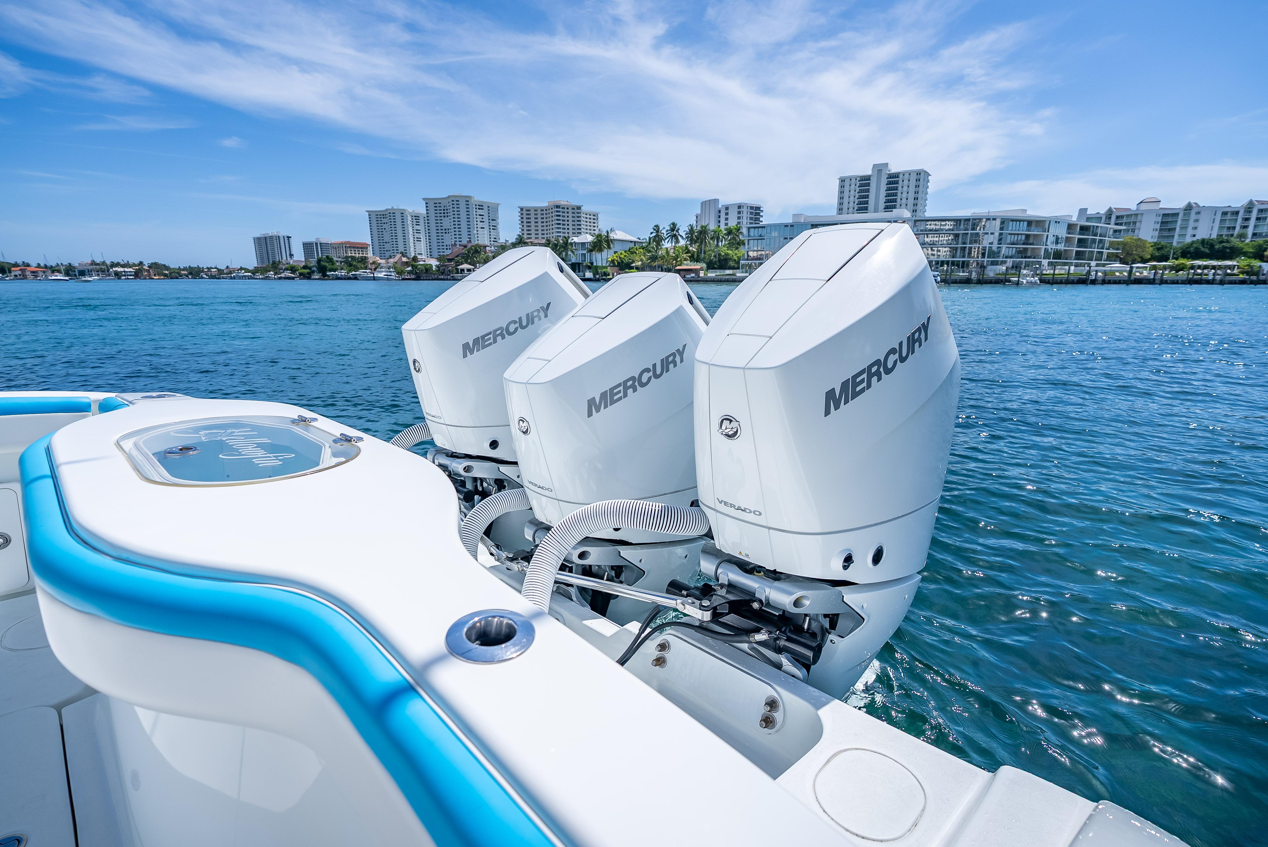 2016 Yellowfin 39 Offshore boat with triple Mercury engines on blue water.