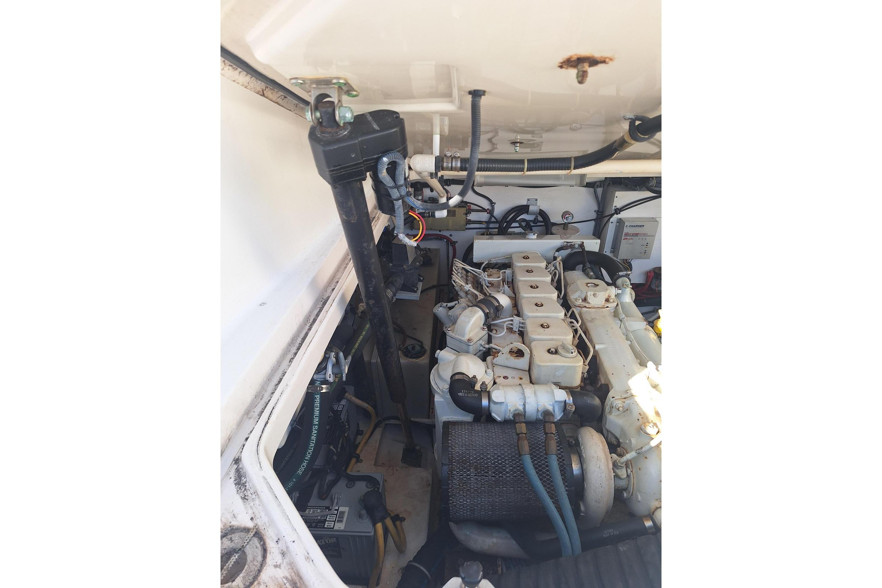 Engine compartment of a 2002 Tiara Yachts 3500 Open, showcasing mechanical components.