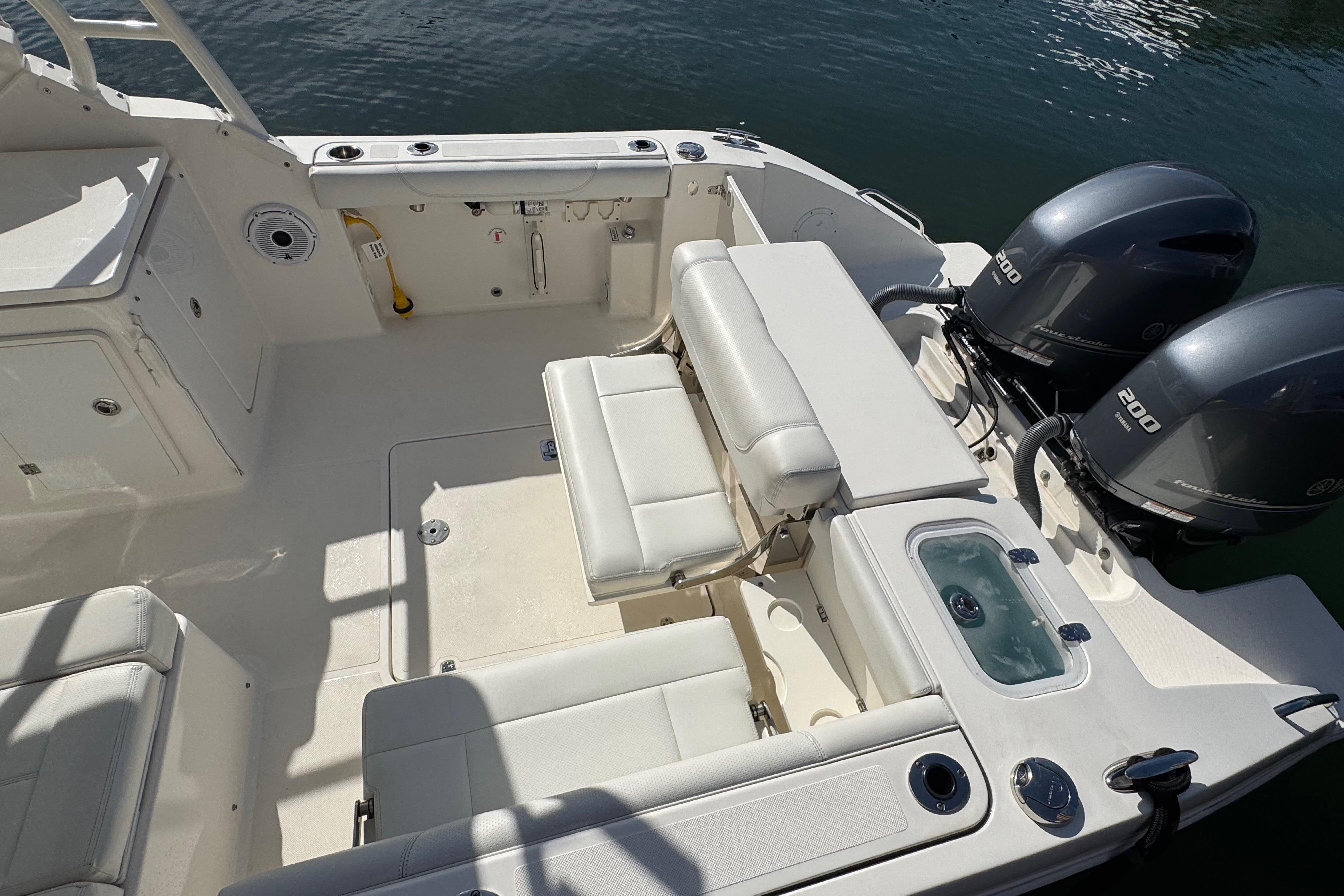 2022 Pursuit DC 266 Dual Console boat interior with seating and twin 200 horsepower engines.