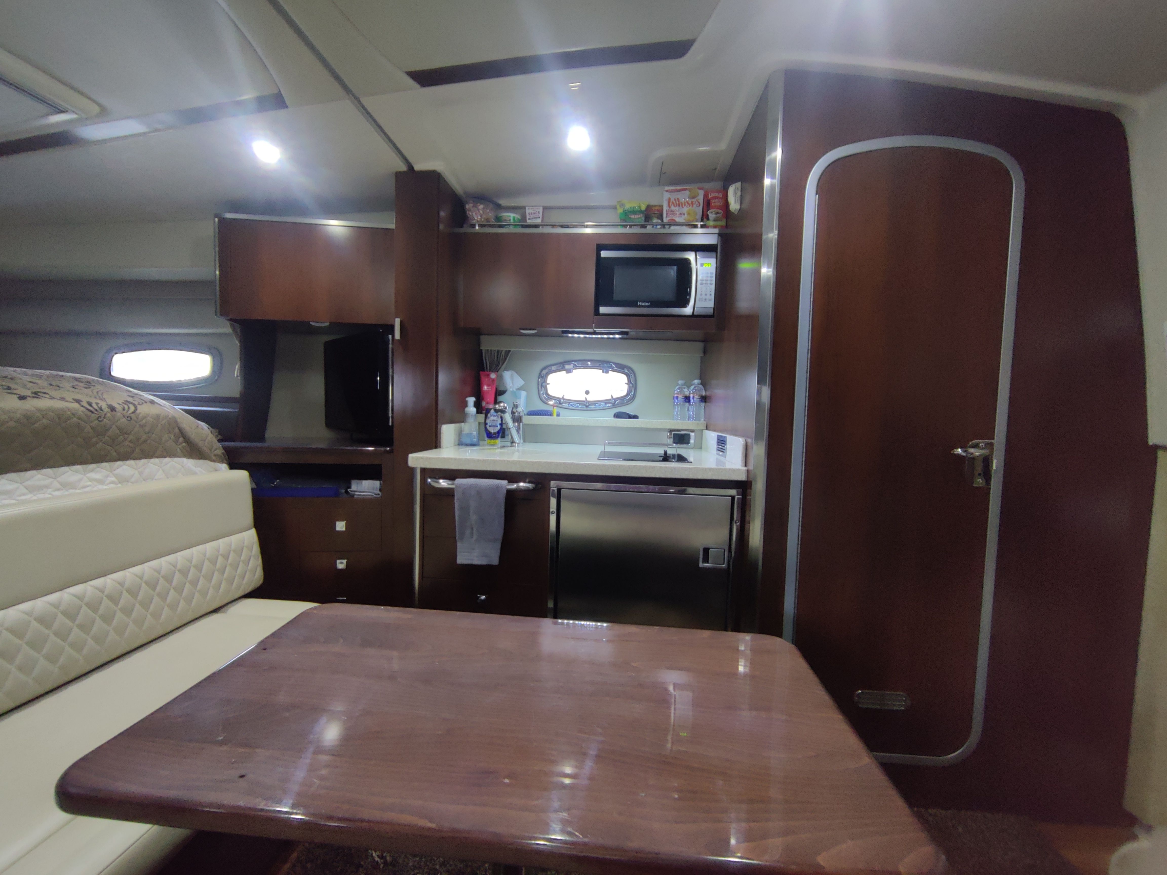 Interior of Chaparral 330 Signature yacht, kitchen and dining area.