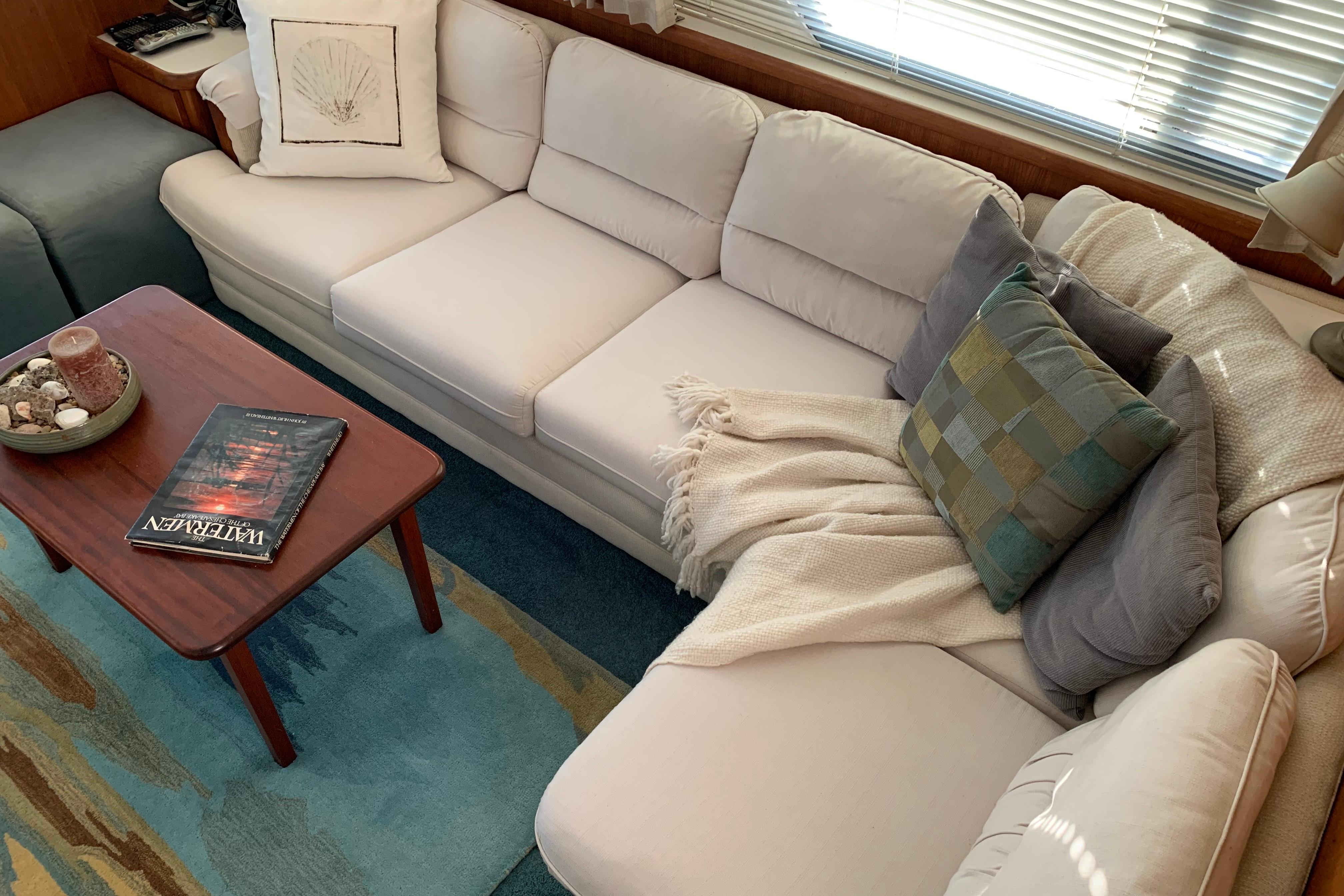 Luxurious interior of 1994 Carver 440 Aft Cabin Motor Yacht with cozy seating area.