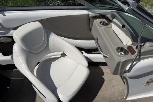 2012 Crownline 215 SS boat interior with white seating and cup holders.