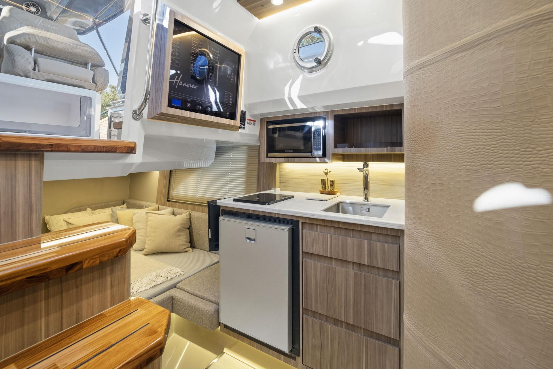 Luxurious Hanover 447 yacht interior with modern kitchen and cozy seating, 2026 model.