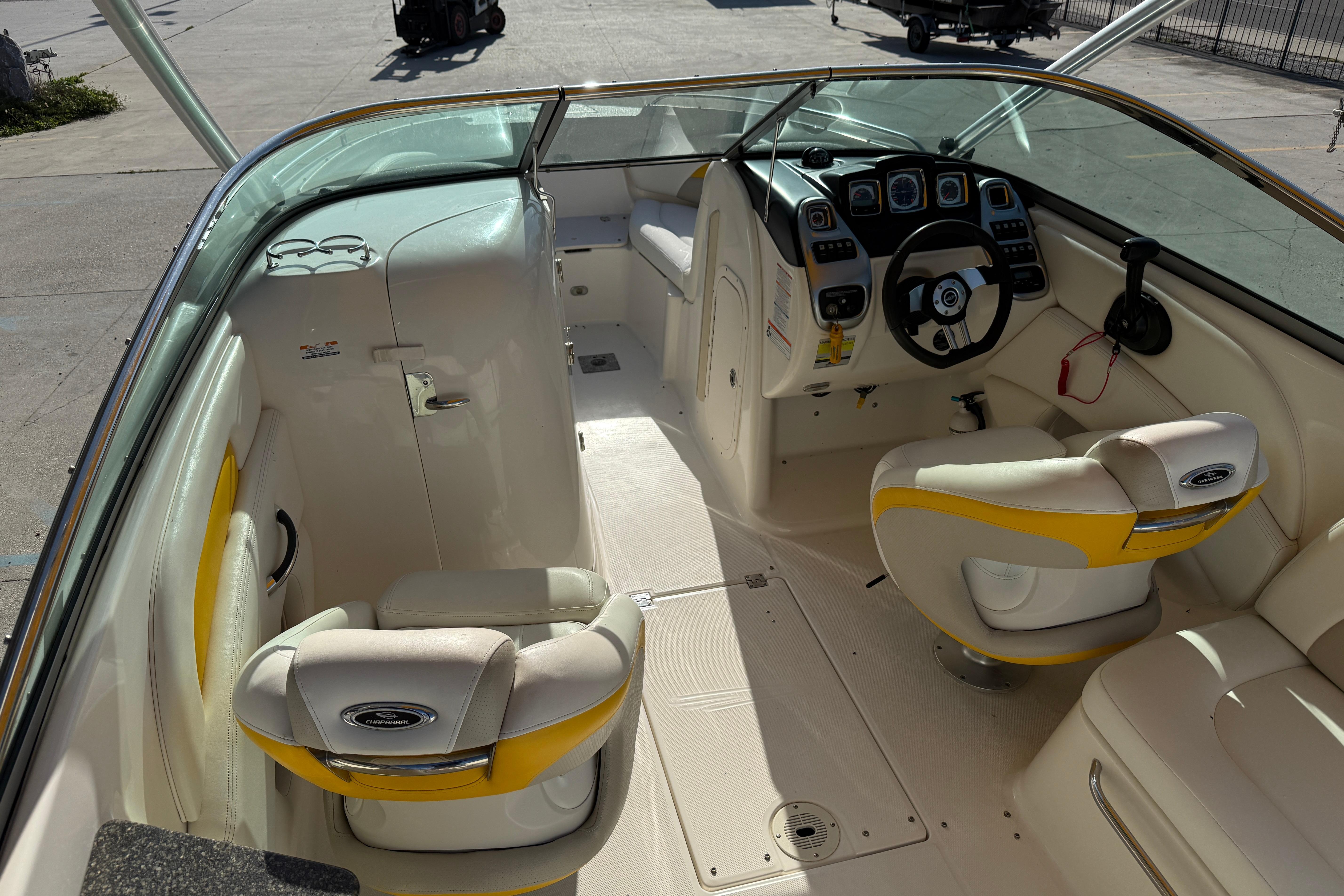 Interior of a 2008 Chaparral 236 SSX boat with white and yellow seating.