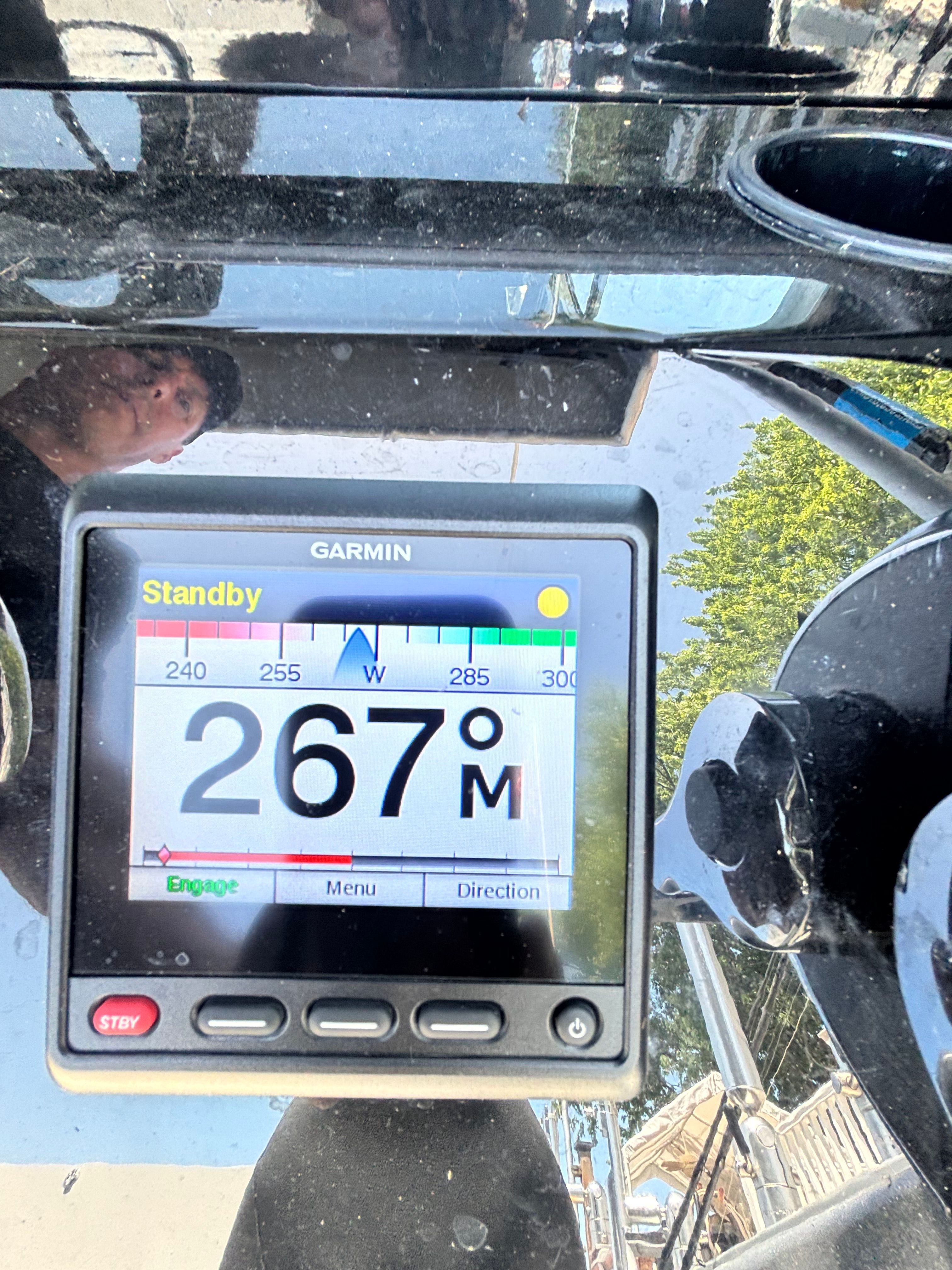 A Garmin navigation device displays a heading of 267 degrees.