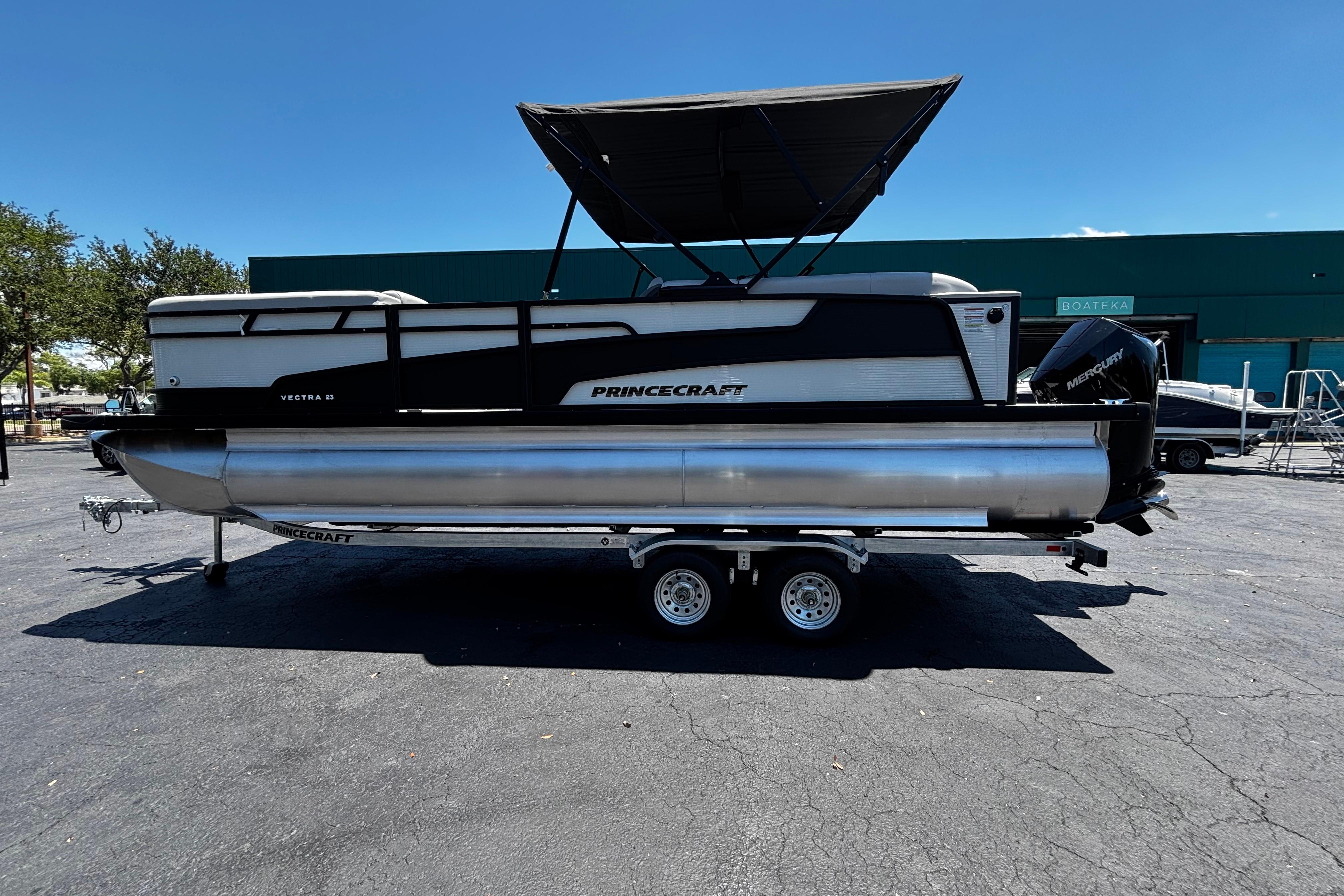 2026 Princecraft Vectra 23 QL pontoon boat on trailer, outdoor display.