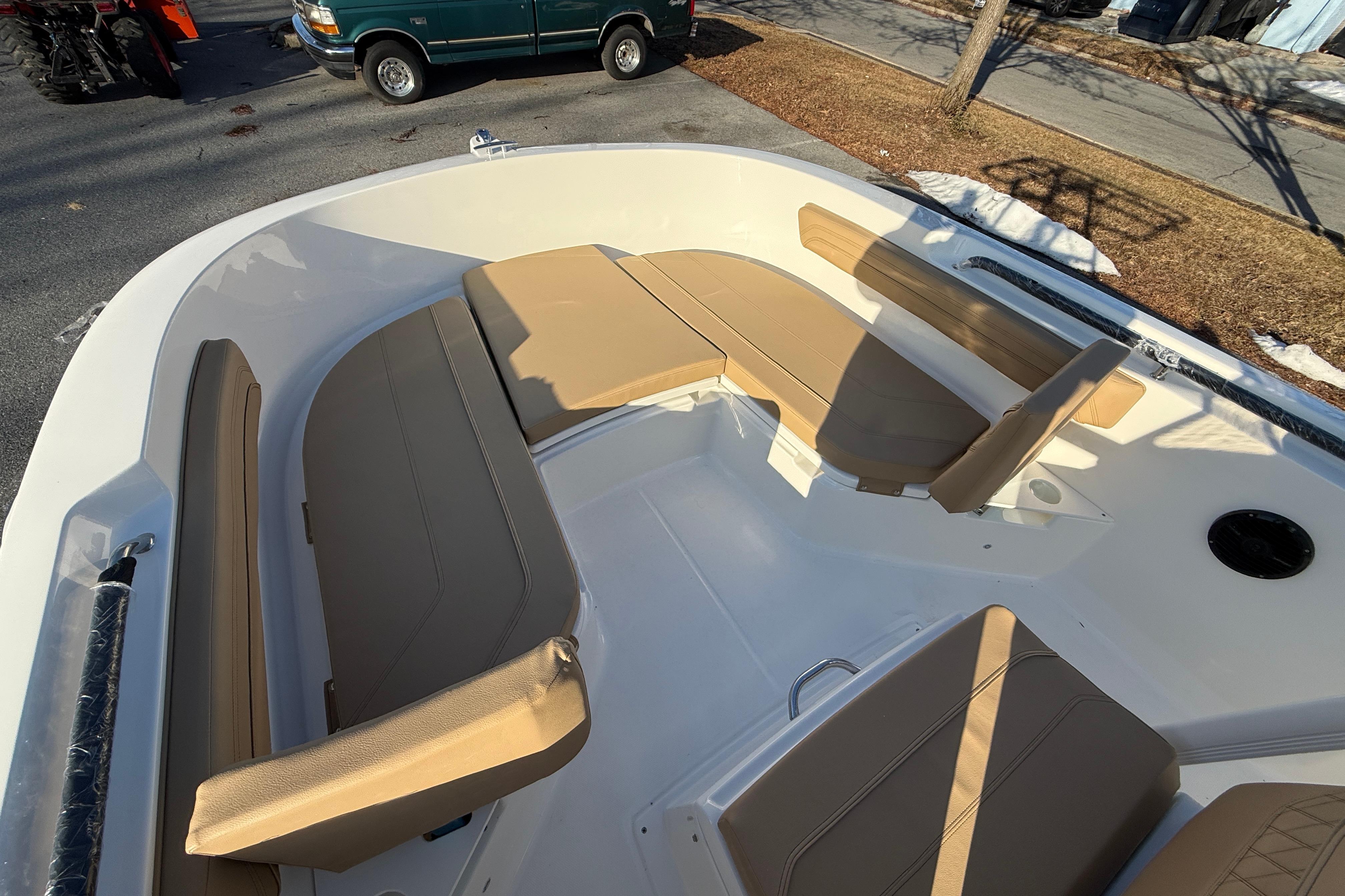 2026 Bayliner Trophy T22CC boat interior with tan seating and spacious layout.