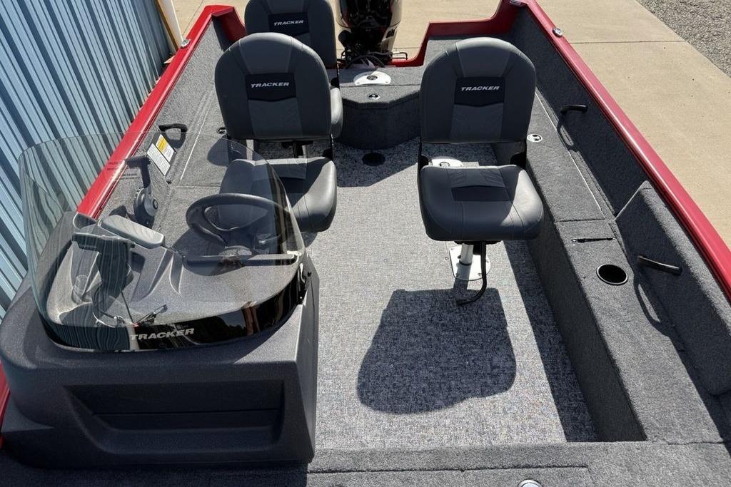 2026 Tracker Pro Guide V-16 SC boat interior with seating and steering console.