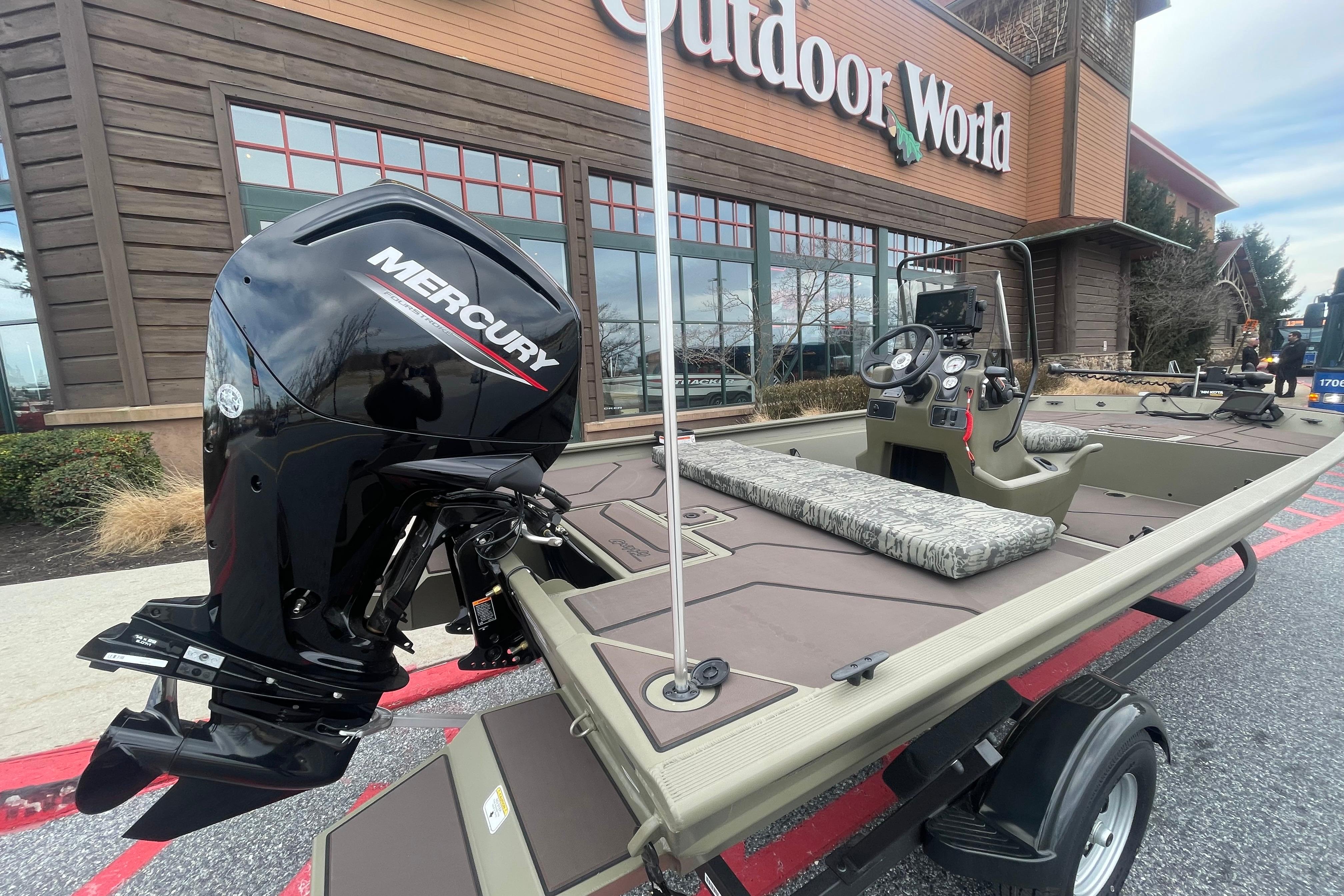 2026 Tracker Grizzly 1860 CC boat outside Outdoor World.