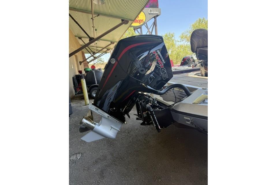 2026 Ranger Z521R Cup-Equipped boat with powerful outboard motor in a shaded area.