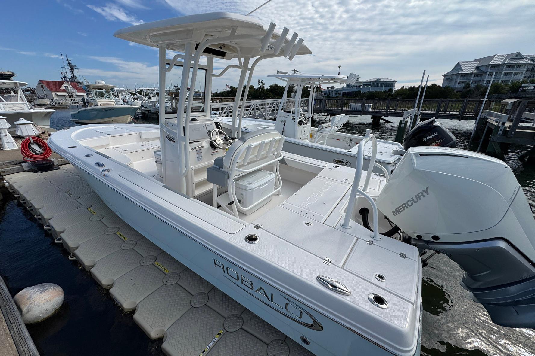 2021 Robalo 246 Cayman boat docked, featuring a Mercury outboard engine.