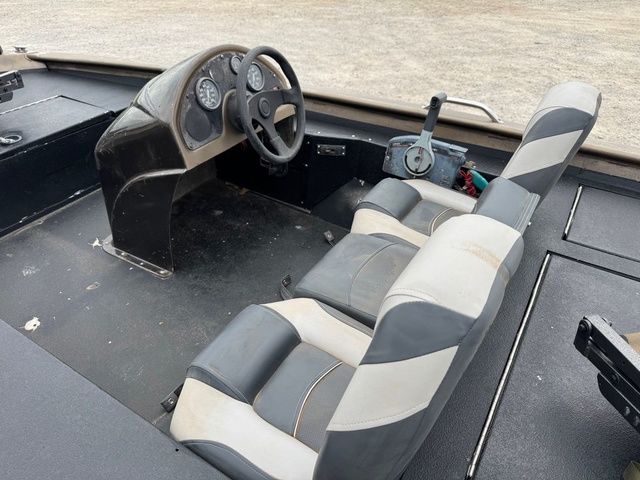 2001 Xpress X51 boat interior with steering wheel and dual seats.