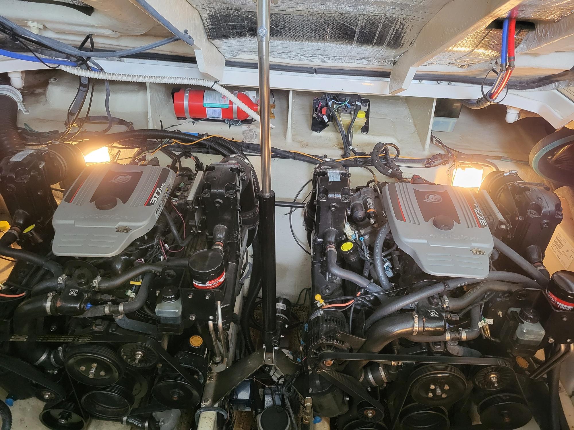 Engine room of a 2009 Sea Ray 310 Sundancer with dual engines and visible wiring.