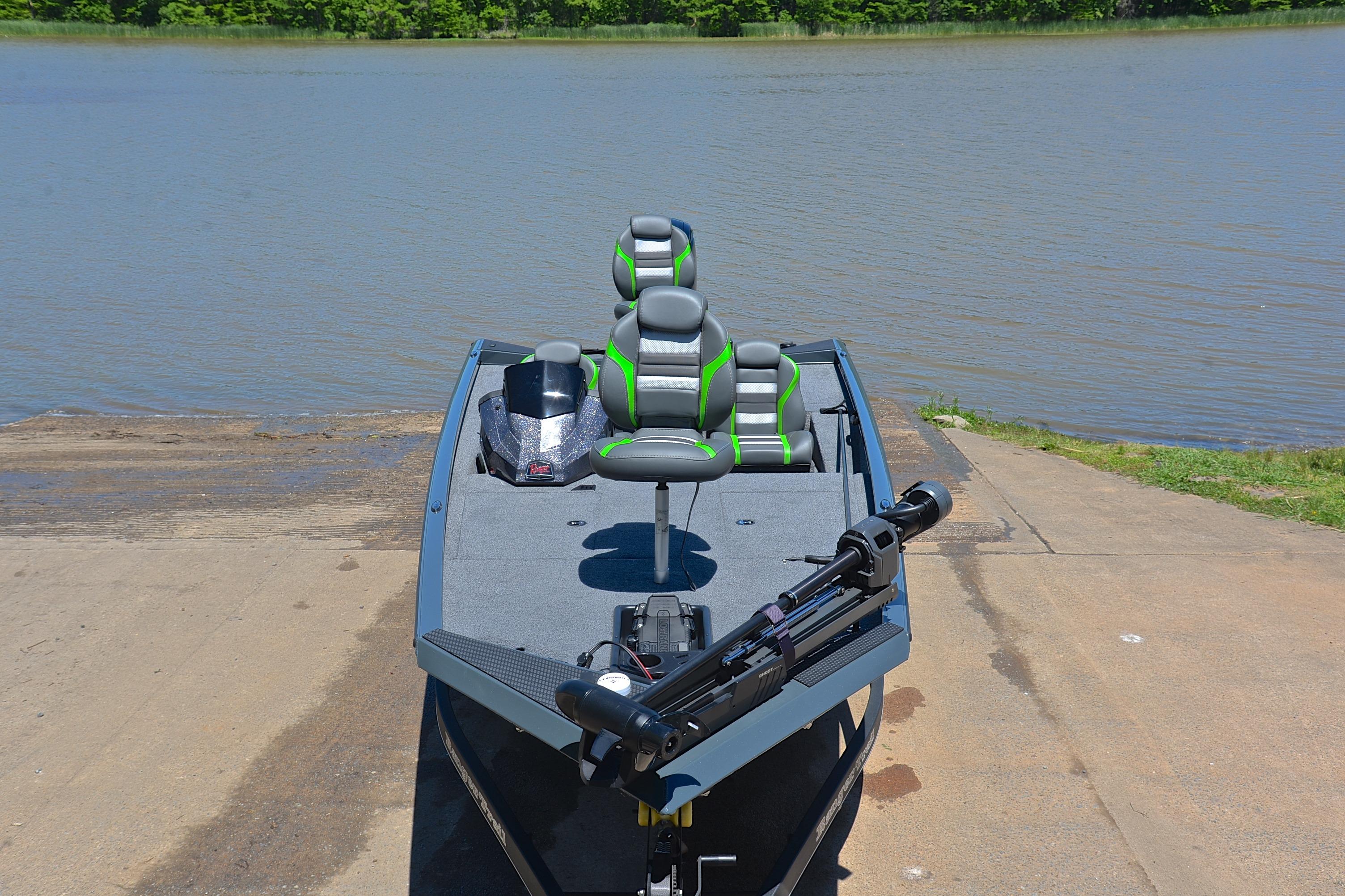 2025 Ranger RT188 boat at a lakeside ramp, featuring modern seating and equipment.