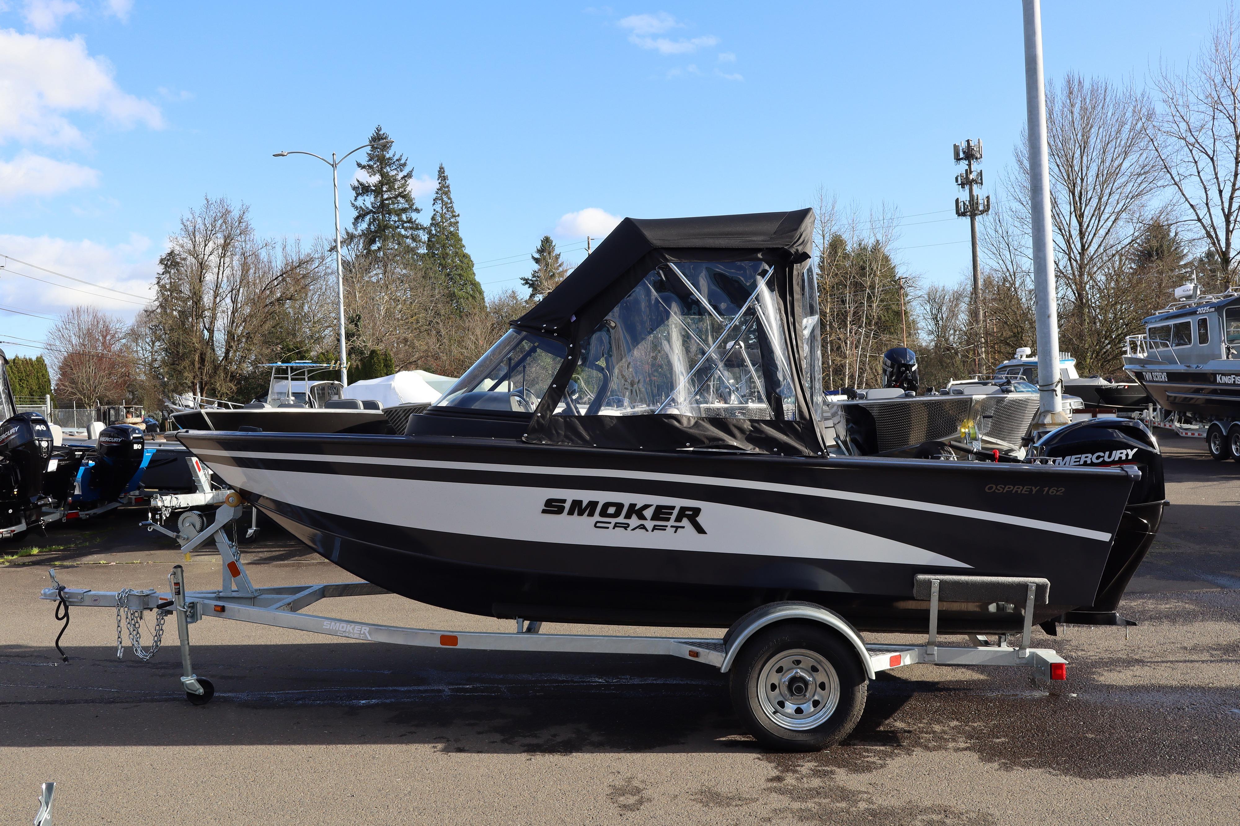 2026 Smoker Craft Osprey 162 boat on trailer, parked outdoors.